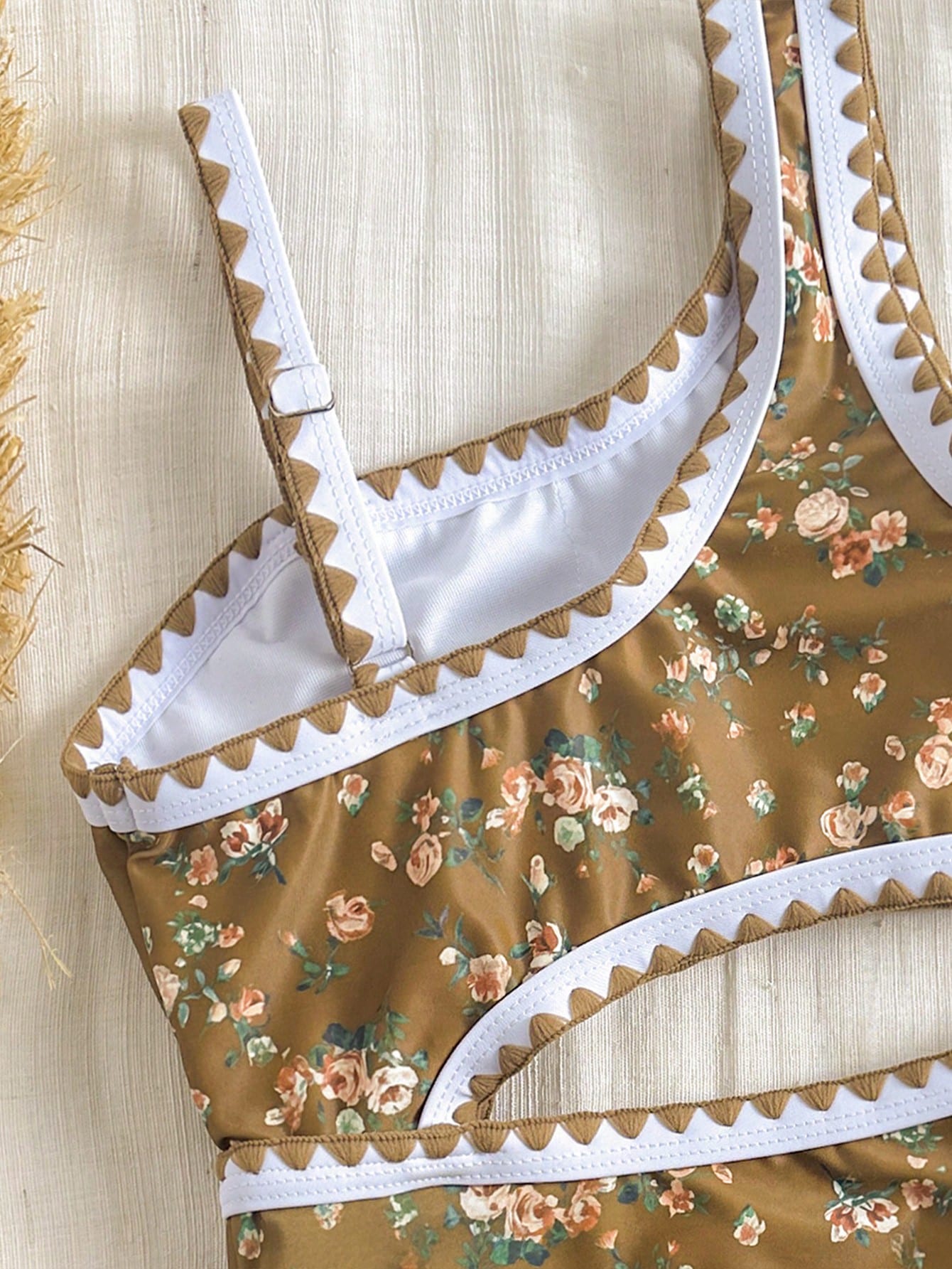 Tween girls one-piece swimsuit featuring an asymmetric neckline, pendant decor, plain design, wireless bra, high-cut bottom, and medium-stretch fabric.