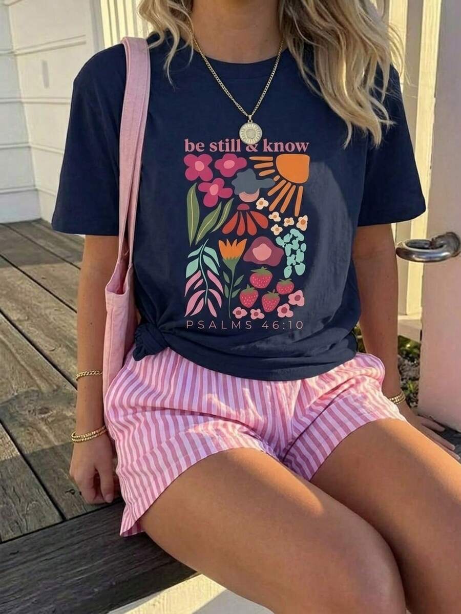 Tween girl wearing a black and white striped drop-shoulder crew neck t-shirt with bow embroidery paired with matching tie-waist shorts.