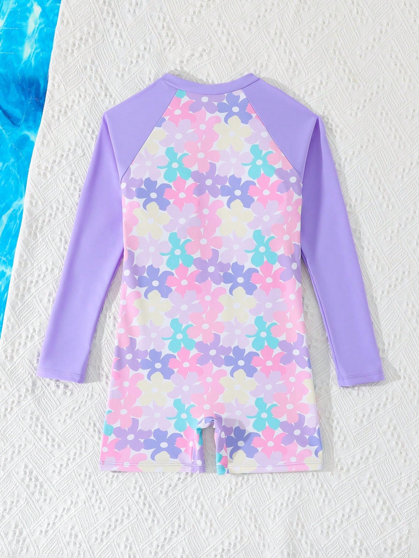 Tween girls one-piece swimsuit featuring a high neck, long sleeves, and shorts bottom, with a back zipper and strawberry plaid digital print on stretch knit fabric. Designed for swimming, vacation, and summer wear.
