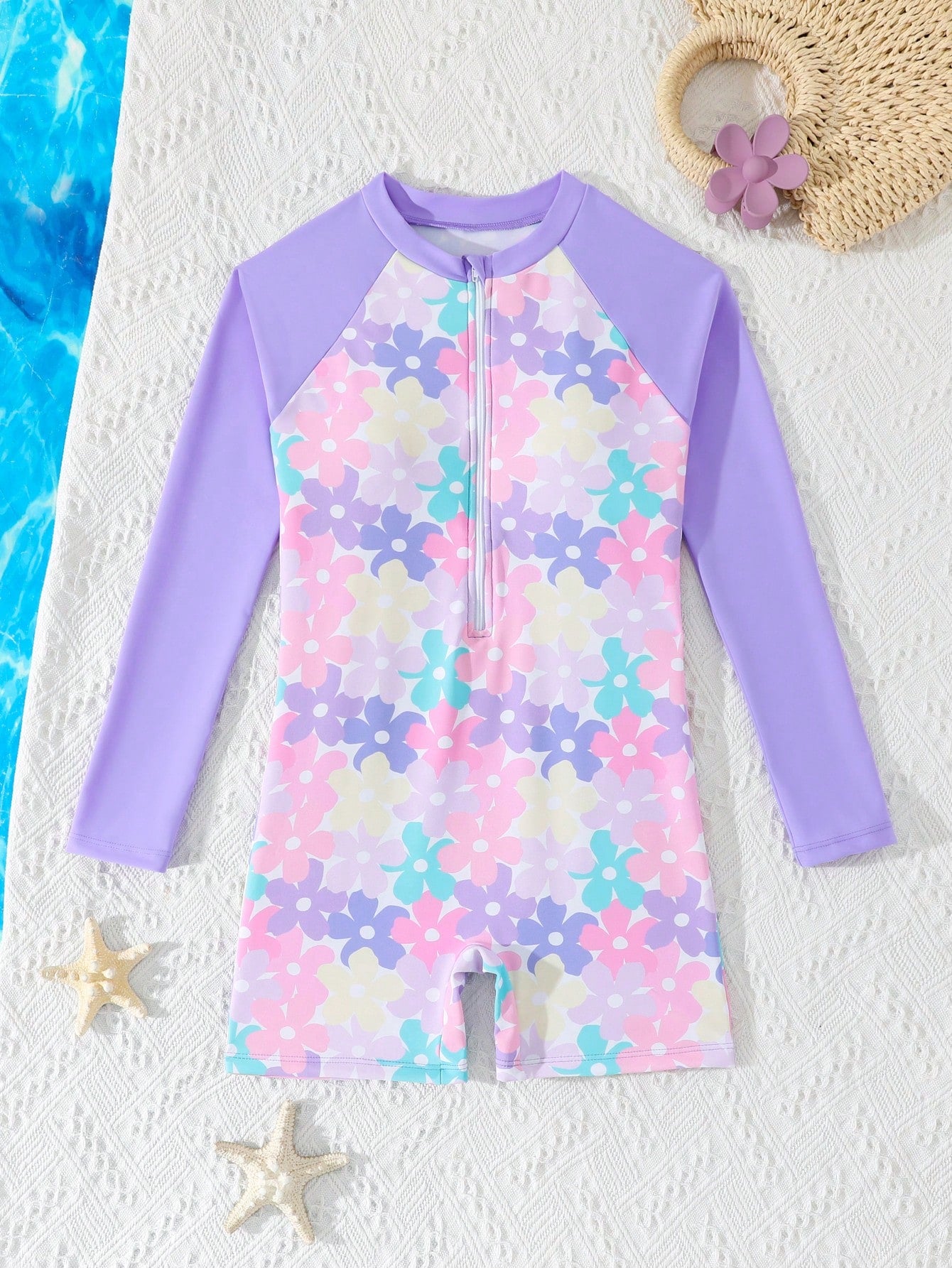 Tween girls one-piece swimsuit featuring a high neck, long sleeves, and shorts bottom, with a back zipper and strawberry plaid digital print on stretch knit fabric. Designed for swimming, vacation, and summer wear.