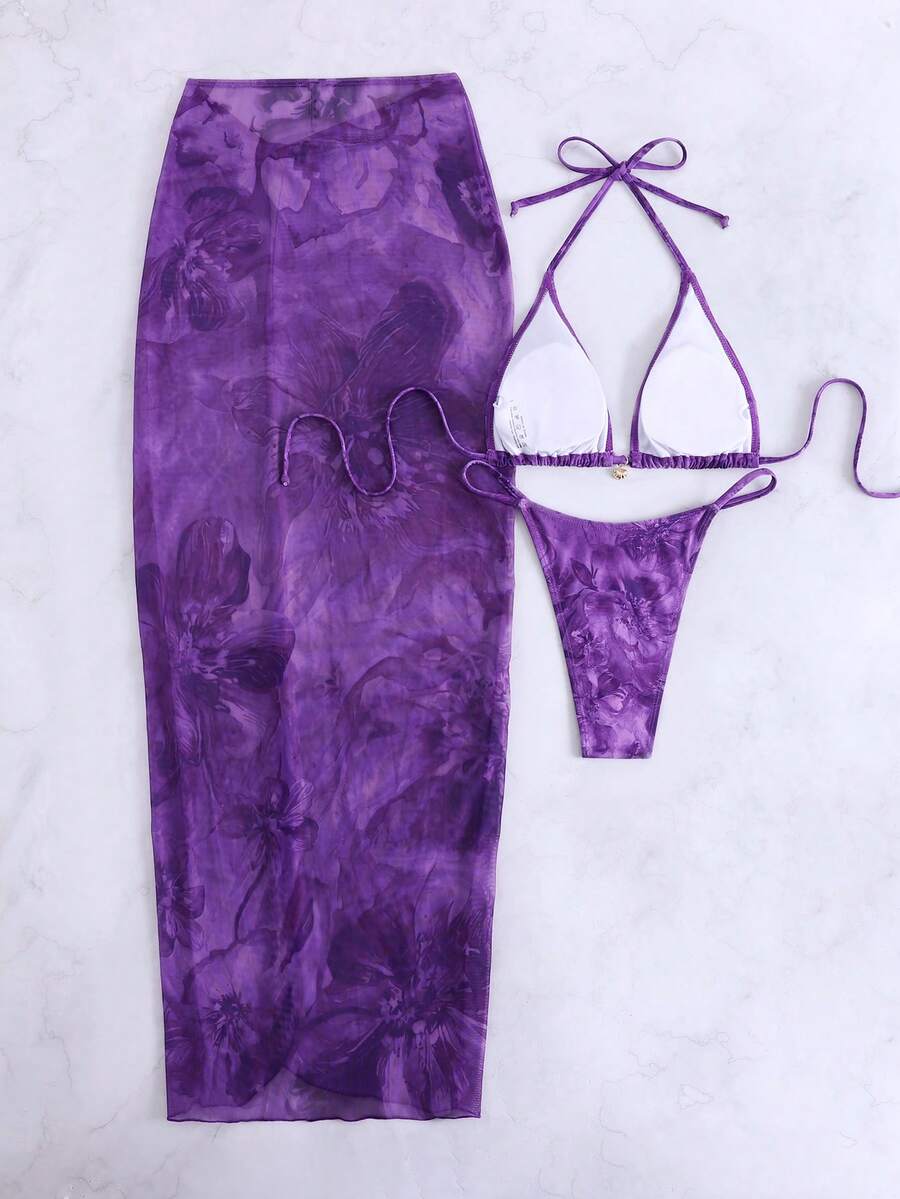 Women's 3-piece floral swimsuit set featuring a multicolor tie-back halter bikini top, low-waist bottoms, and a matching sheer mesh maxi skirt.