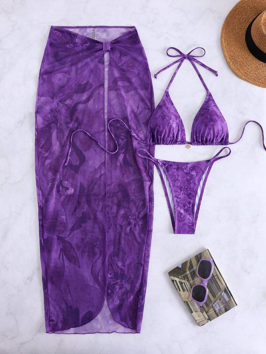 Women's 3-piece floral swimsuit set featuring a multicolor tie-back halter bikini top, low-waist bottoms, and a matching sheer mesh maxi skirt.