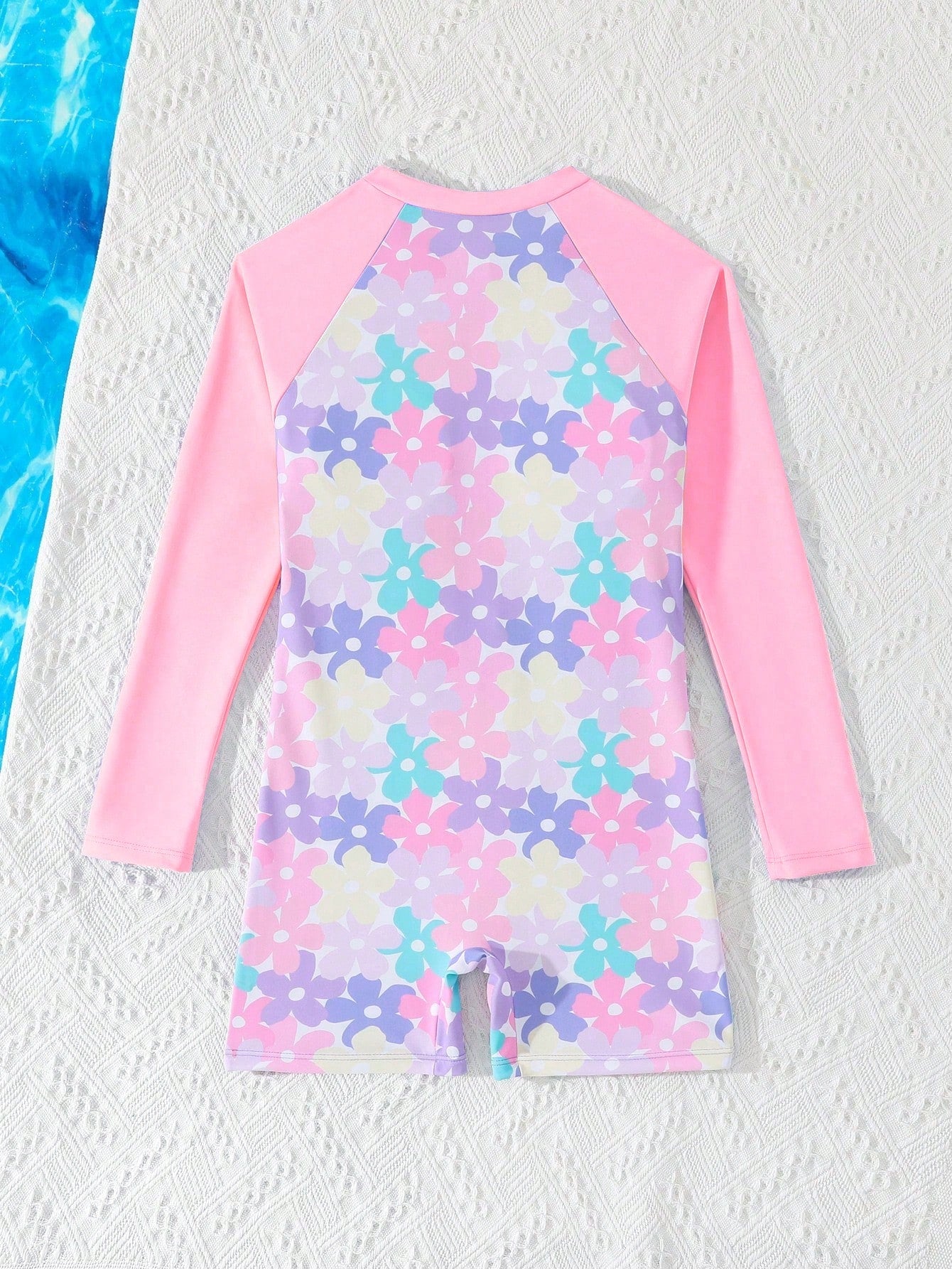 Tween girls one-piece swimsuit featuring a high neck, long sleeves, and shorts bottom, with a back zipper and strawberry plaid digital print on stretch knit fabric. Designed for swimming, vacation, and summer wear.