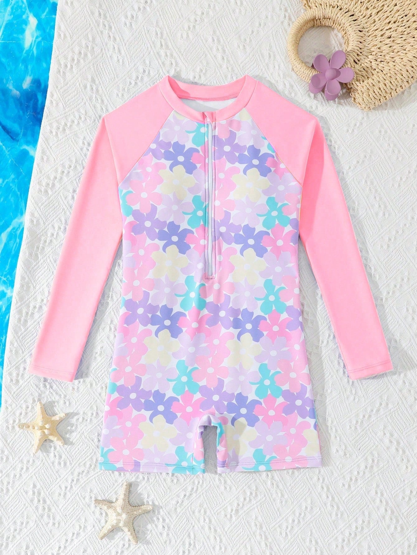 Tween girls one-piece swimsuit featuring a high neck, long sleeves, and shorts bottom, with a back zipper and strawberry plaid digital print on stretch knit fabric. Designed for swimming, vacation, and summer wear.