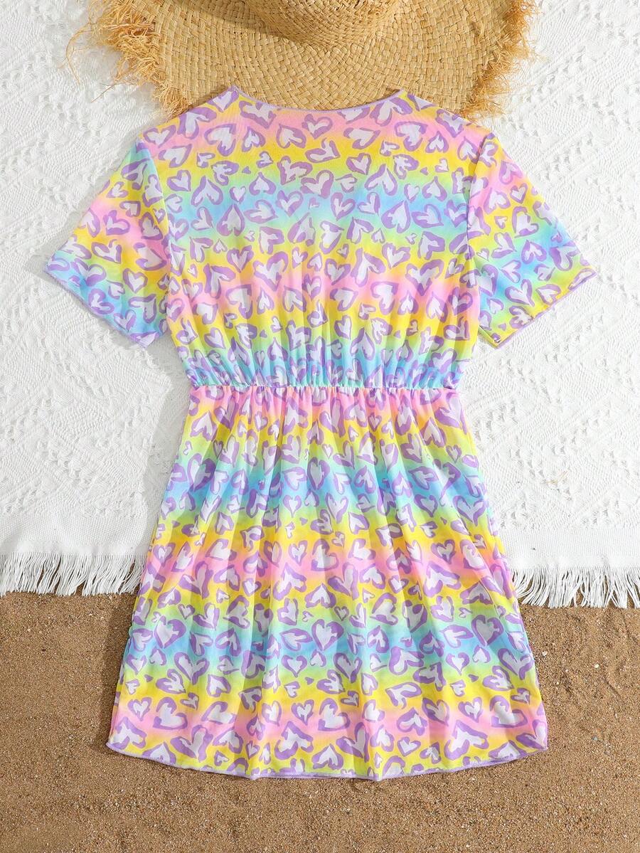 Multicolor heart print long cover up dress for tween girls featuring a V-neck criss-cross wrap front and short sleeves.