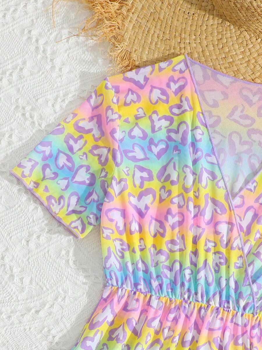 Multicolor heart print long cover up dress for tween girls featuring a V-neck criss-cross wrap front and short sleeves.