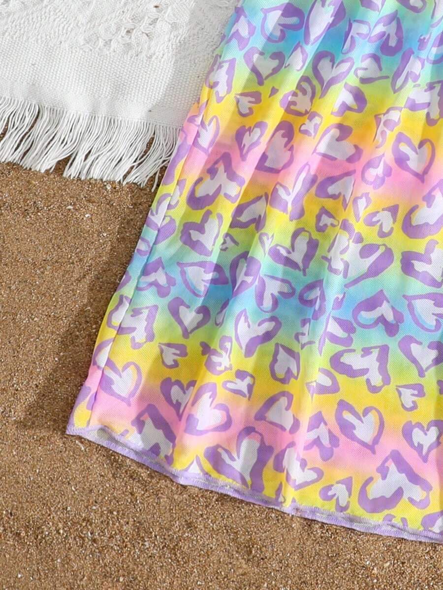Multicolor heart print long cover up dress for tween girls featuring a V-neck criss-cross wrap front and short sleeves.