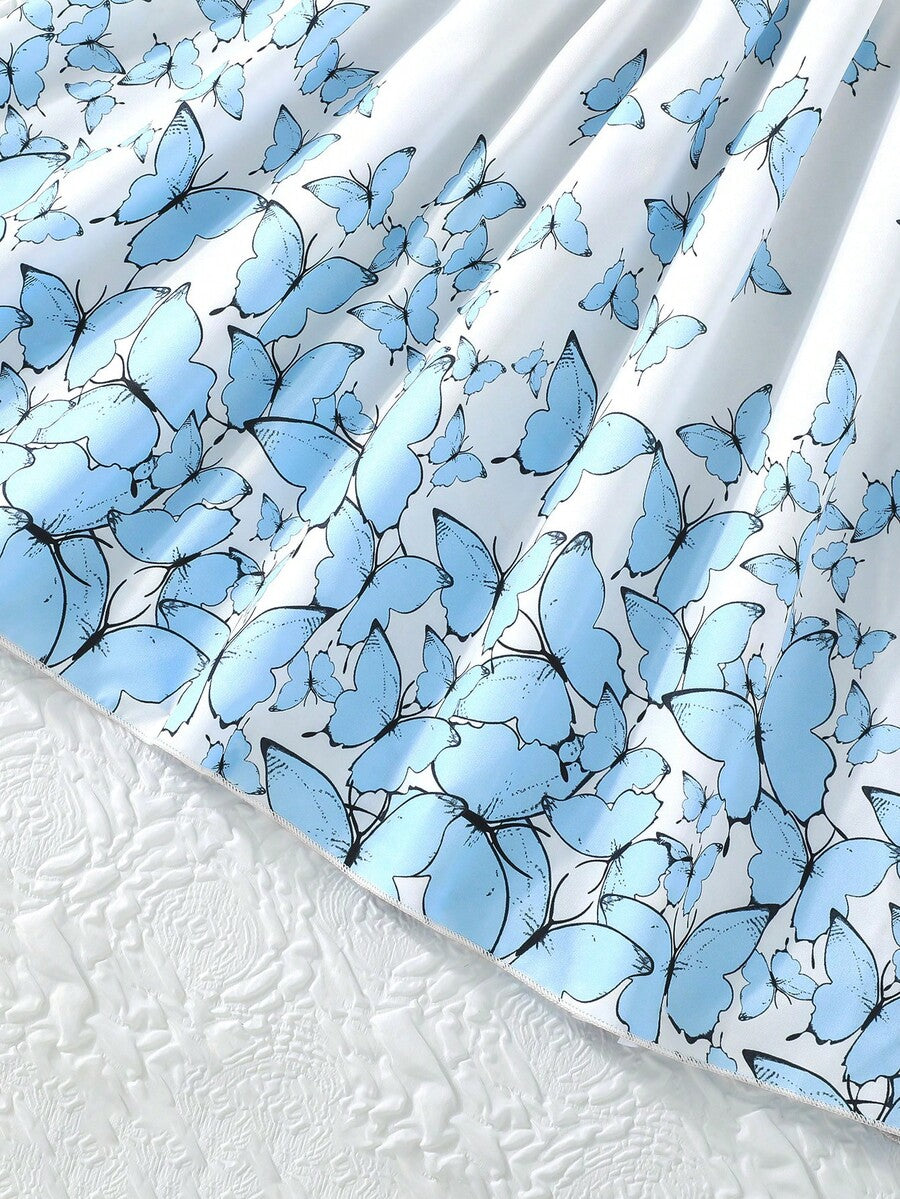 Tween girls blue floral print A-line midi dress featuring round neck, ruffle and contrast mesh details, high waist, and flared hem.