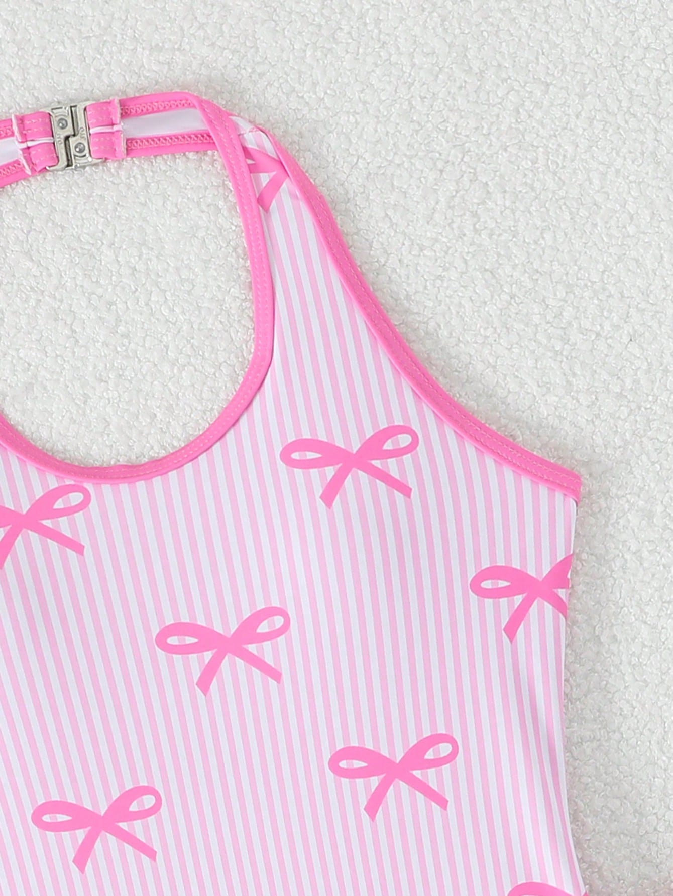 Girls 2-piece swimwear set featuring a butterfly print halter swimsuit top with contrast piping and separate mid-waist shorts; sleeveless, high-stretch, wireless design for beach and vacation wear.