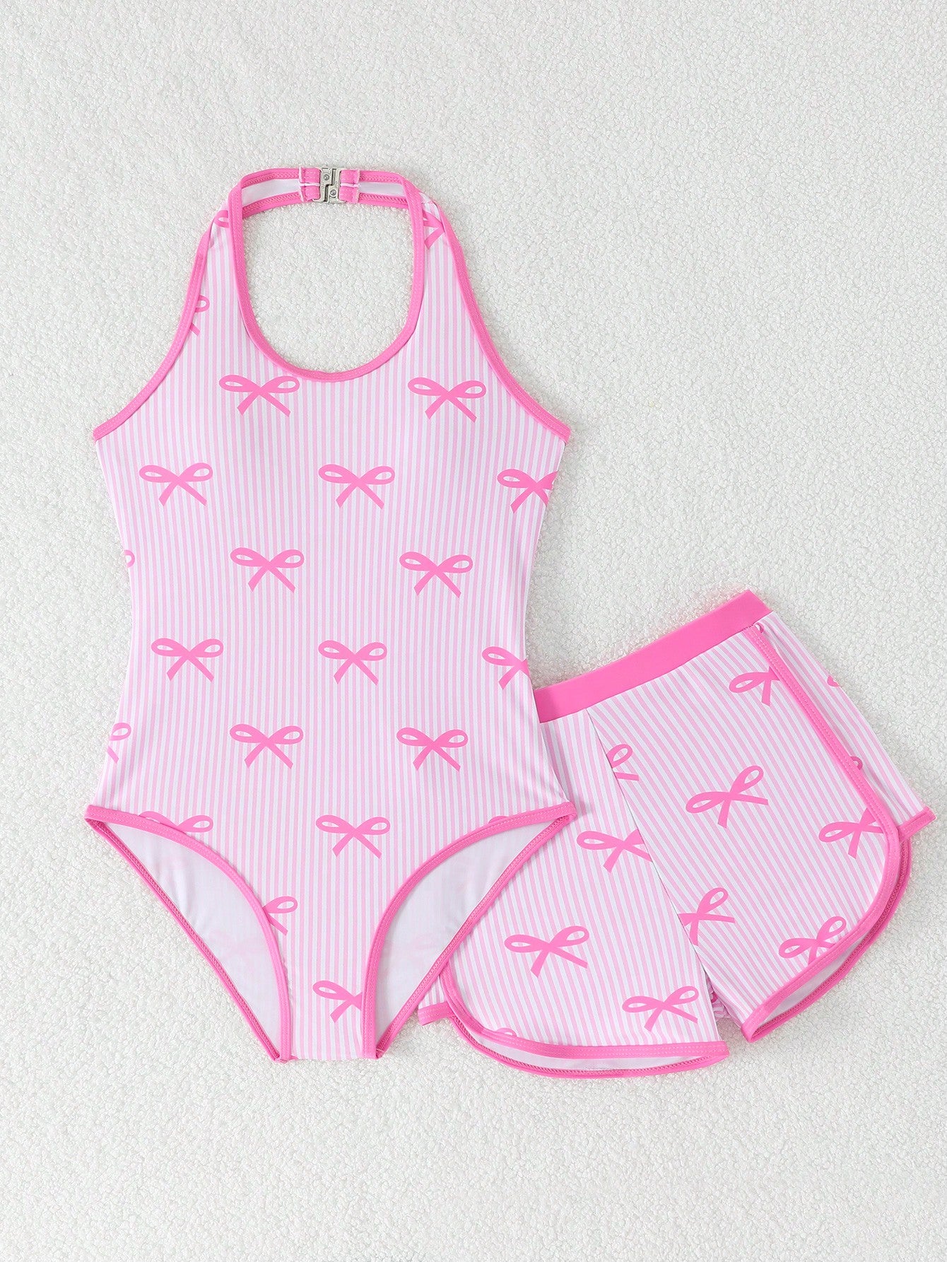 Girls 2-piece swimwear set featuring a butterfly print halter swimsuit top with contrast piping and separate mid-waist shorts; sleeveless, high-stretch, wireless design for beach and vacation wear.
