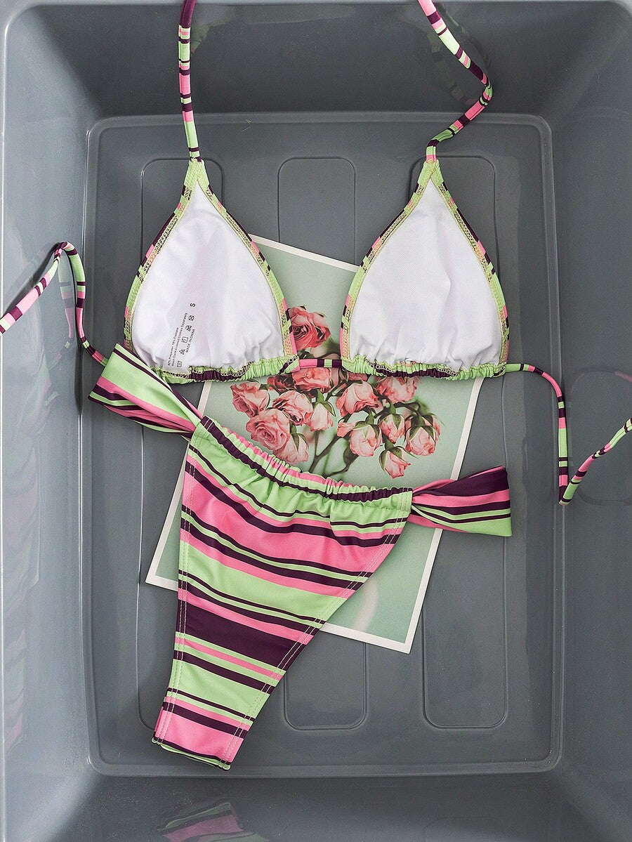 Women's striped halter two-piece swimsuit featuring a lace-up triangle top with removable padding and high-cut low-waist bikini bottoms.