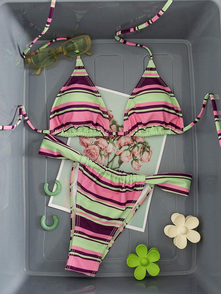 Women's striped halter two-piece swimsuit featuring a lace-up triangle top with removable padding and high-cut low-waist bikini bottoms.