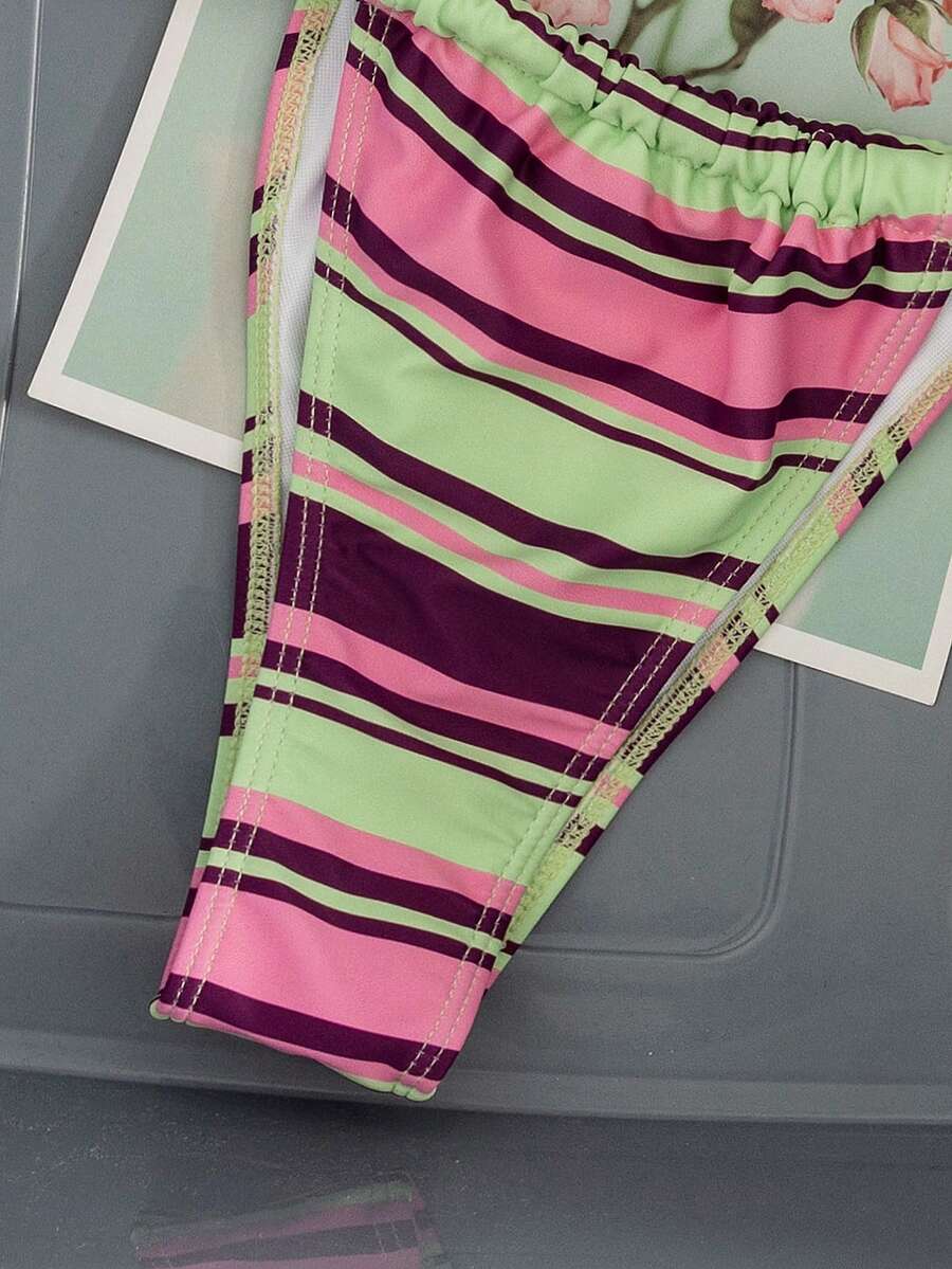 Women's striped halter two-piece swimsuit featuring a lace-up triangle top with removable padding and high-cut low-waist bikini bottoms.