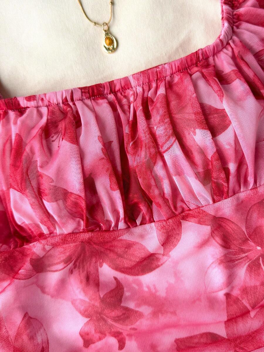 Teen girls red floral print A-line party dress featuring short puff sleeves, square neckline, ruched bust, and contrast lace details.