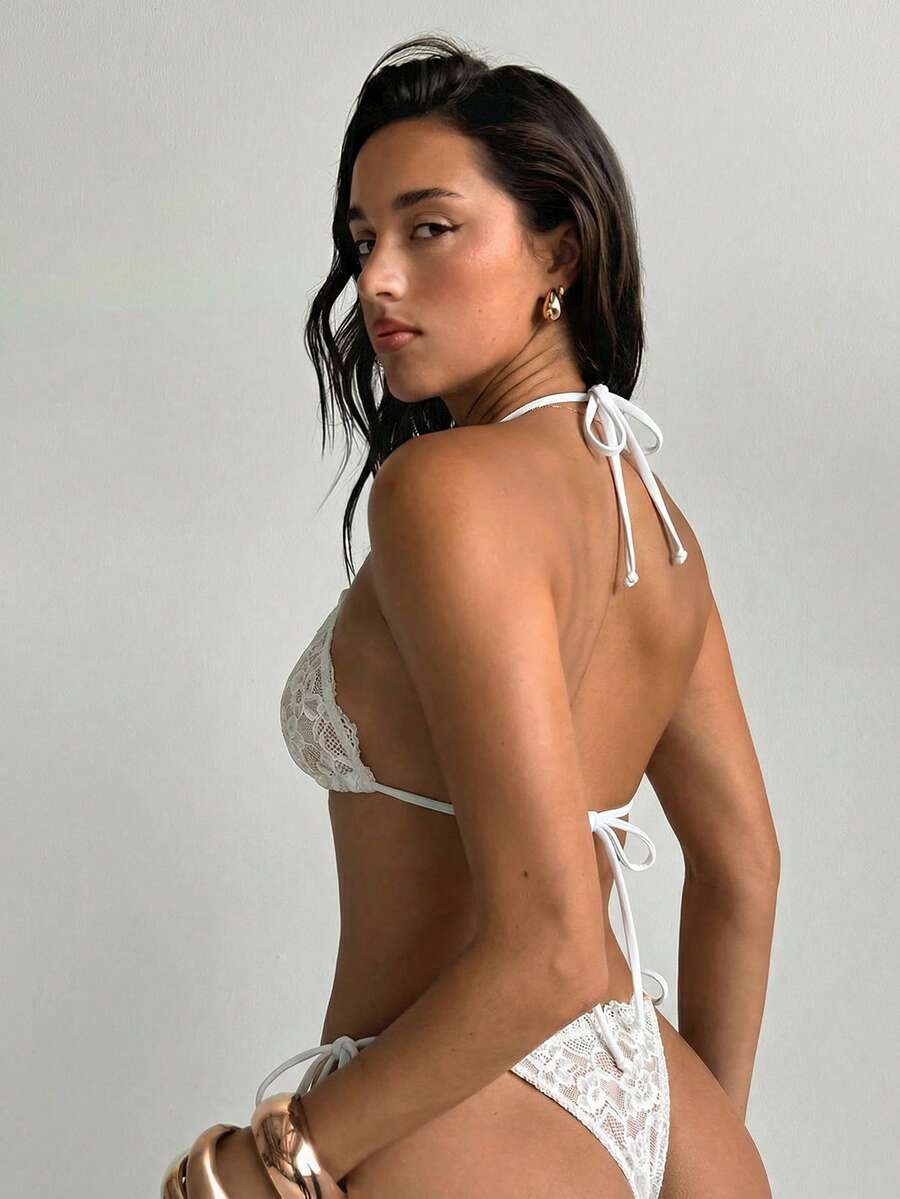 Black high-waisted bikini set featuring a halter wireless triangle top and adjustable tie-side bottoms for women.