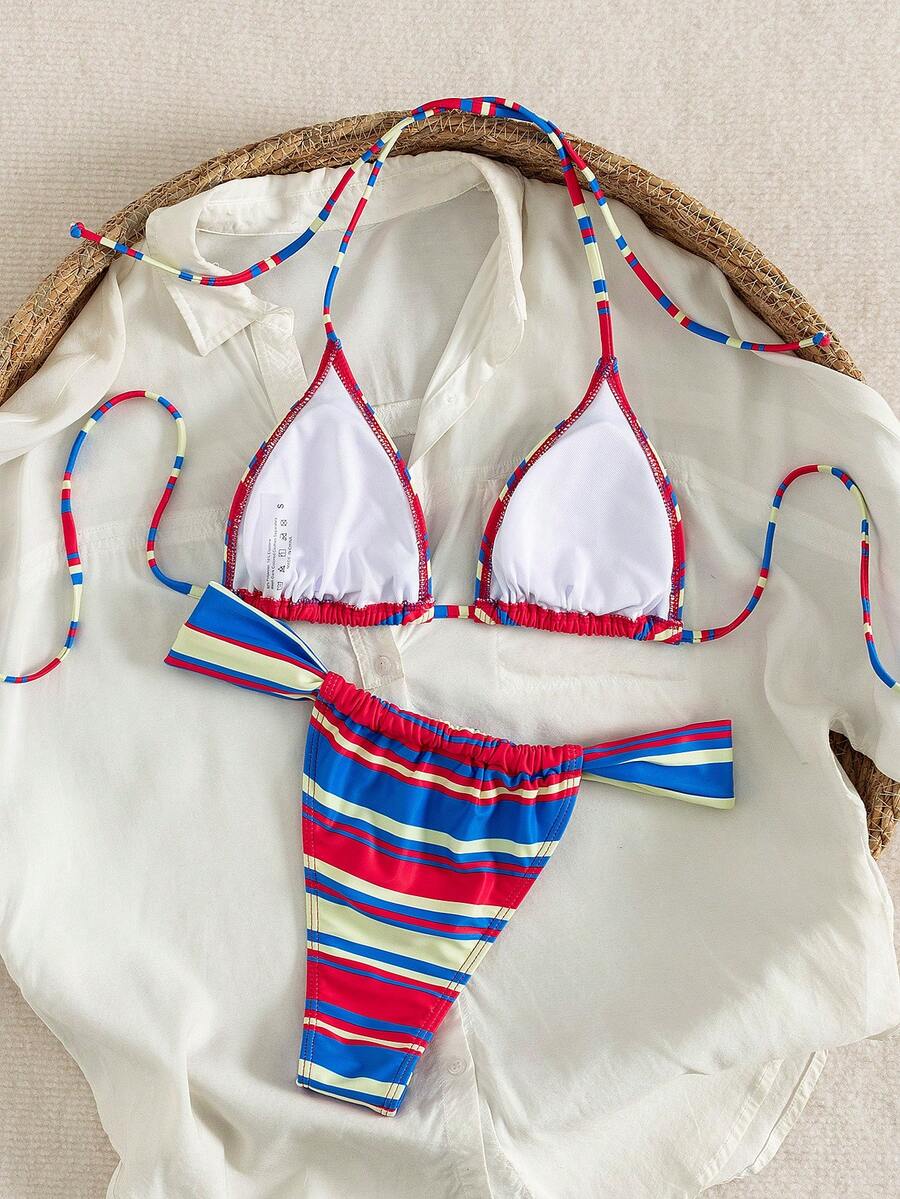 Women's striped halter two-piece swimsuit featuring a lace-up triangle top with removable padding and high-cut low-waist bikini bottoms.