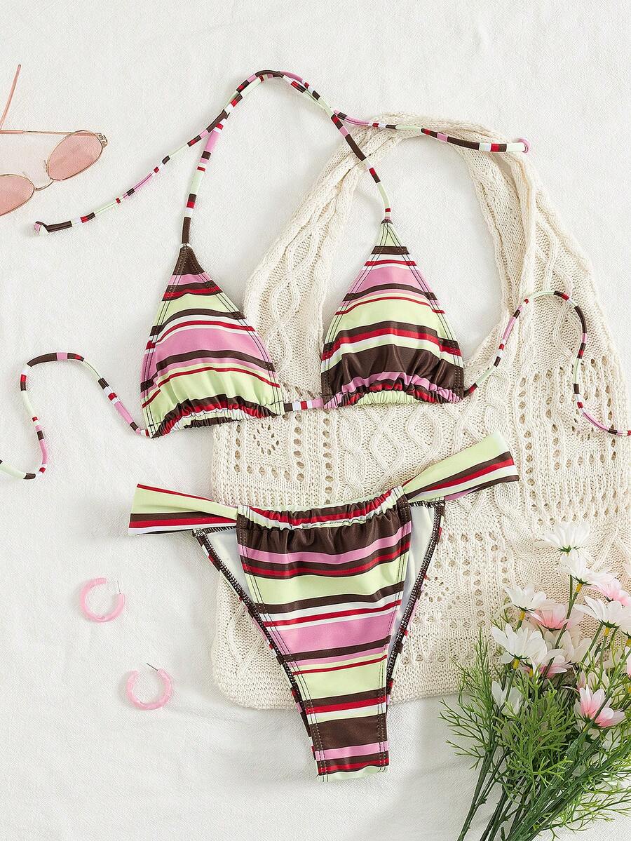 Women's striped halter two-piece swimsuit featuring a lace-up triangle top with removable padding and high-cut low-waist bikini bottoms.