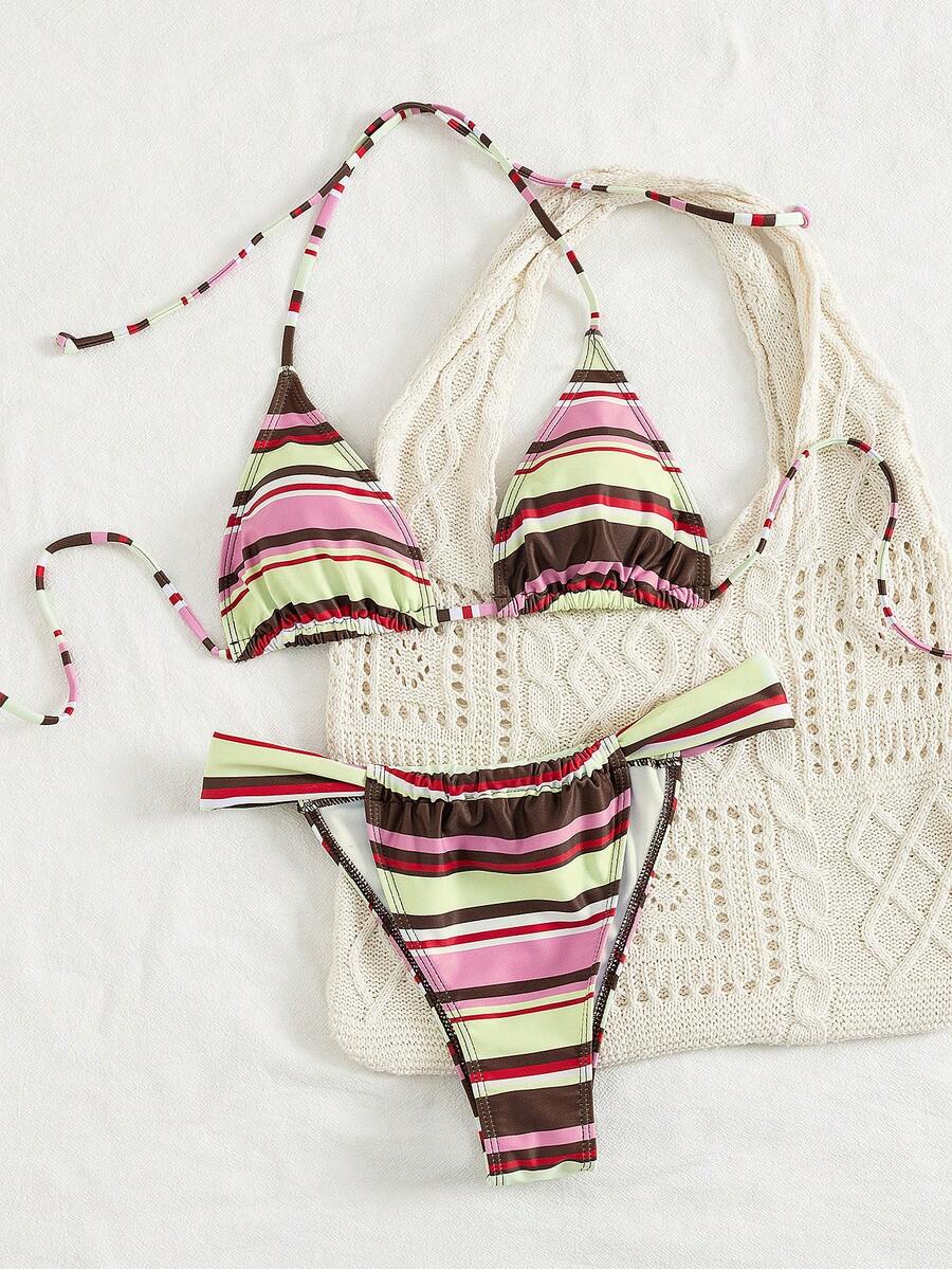 Women's striped halter two-piece swimsuit featuring a lace-up triangle top with removable padding and high-cut low-waist bikini bottoms.