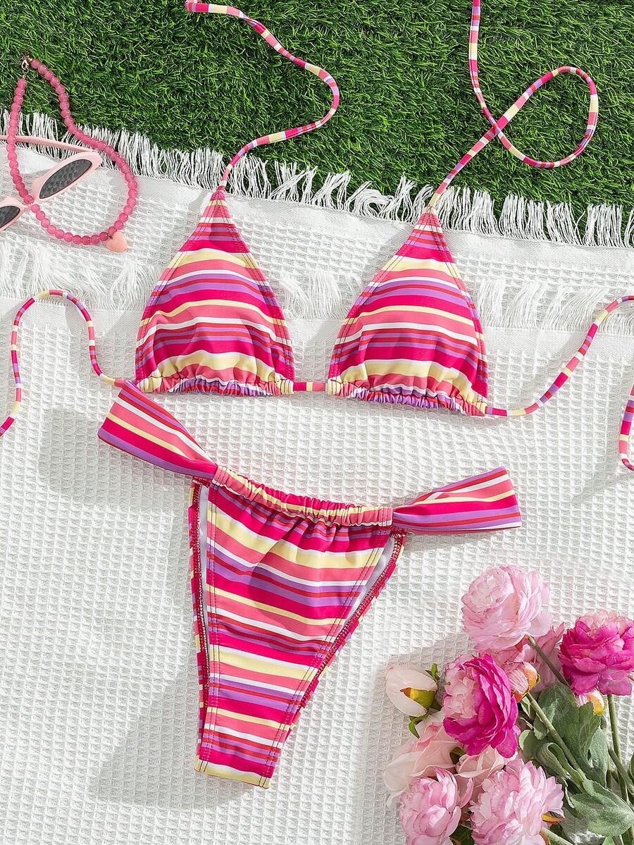 Women's striped halter two-piece swimsuit featuring a lace-up triangle top with removable padding and high-cut low-waist bikini bottoms.