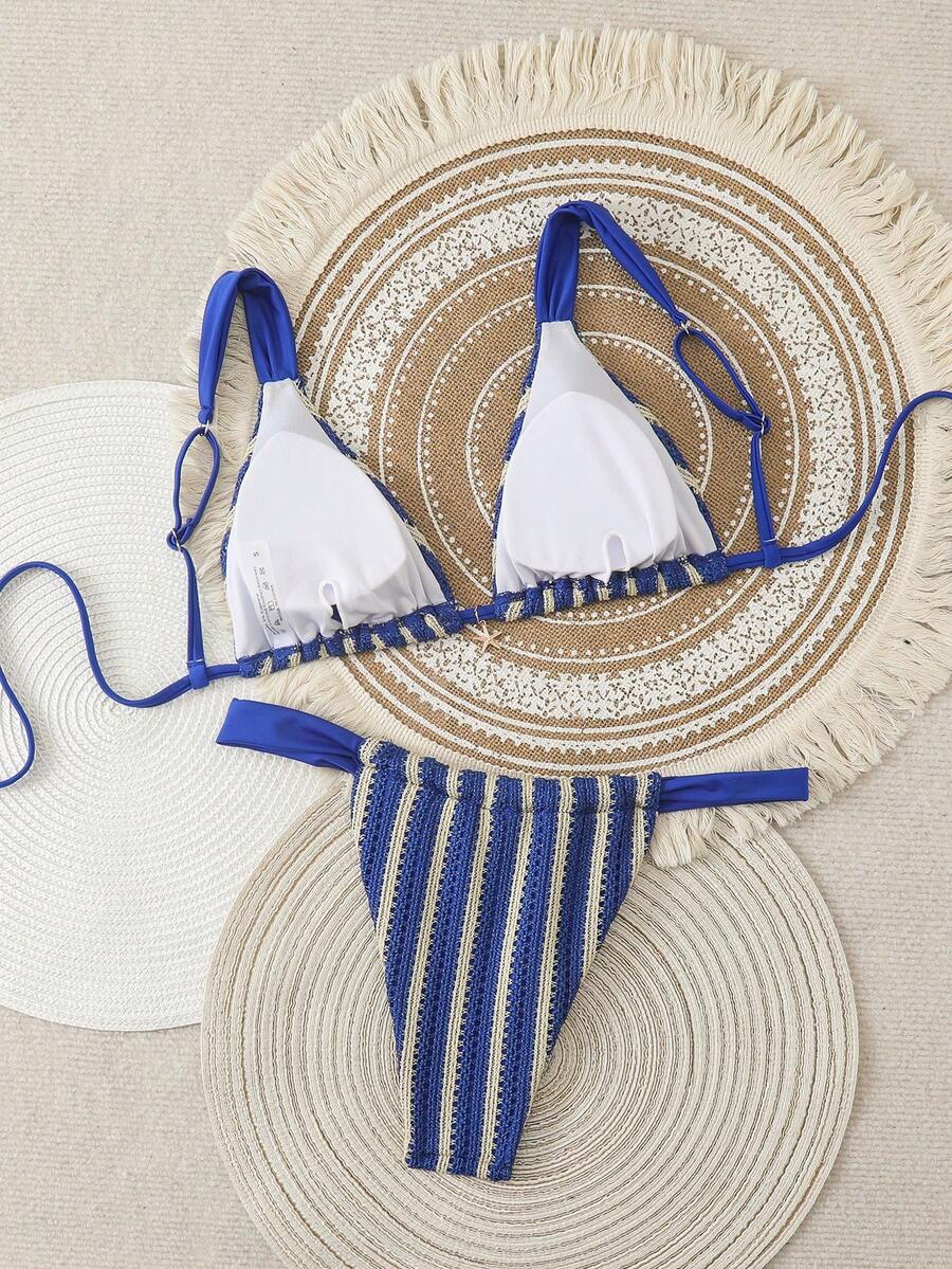 Women's 2-piece triangle cup bikini set in solid color featuring woven pearl shell decoration, halter neckline, and high-waist side-tie ruched bottoms.