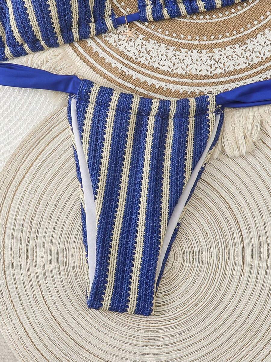 Women's 2-piece triangle cup bikini set in solid color featuring woven pearl shell decoration, halter neckline, and high-waist side-tie ruched bottoms.