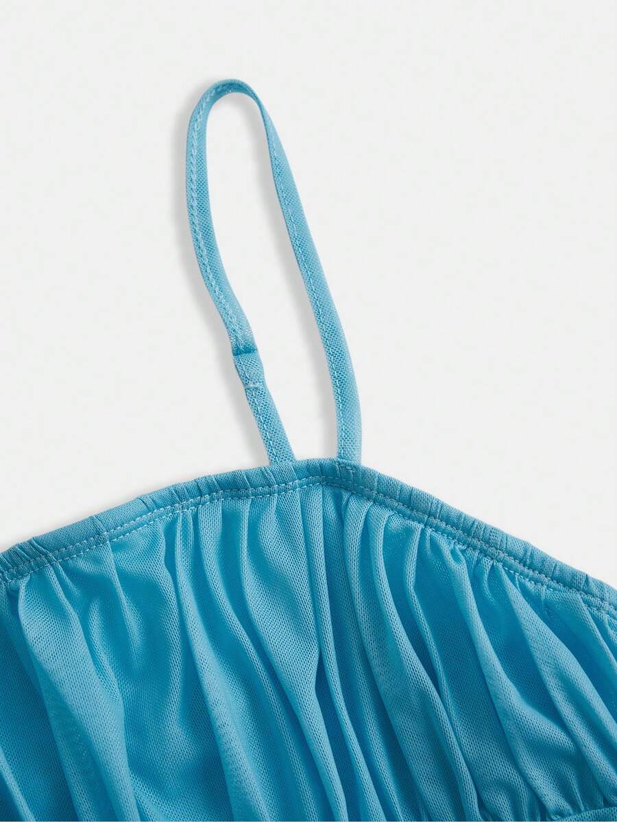 Apricot tween girls sleeveless halter cami dress with appliques, bow front, zipper detail, high waist, flared hem, and short slim fit design.