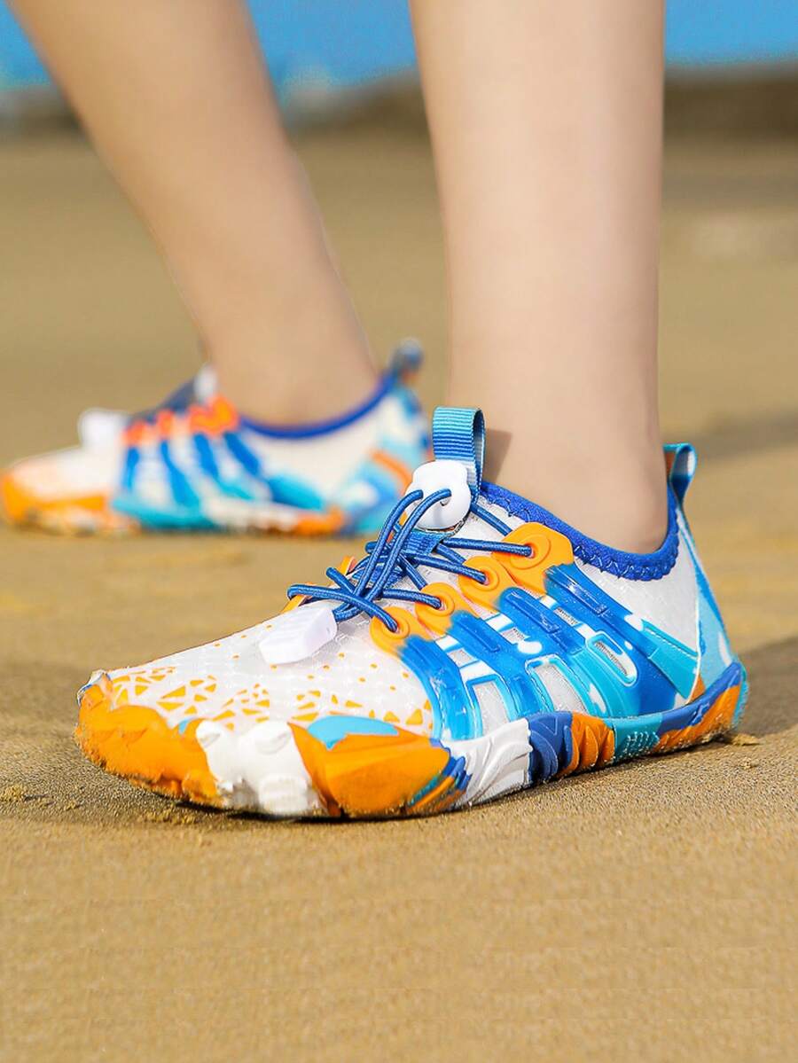 Apricot children's water shoes featuring slip-on fabric uppers, drawstring details, and rubber soles for beach play.