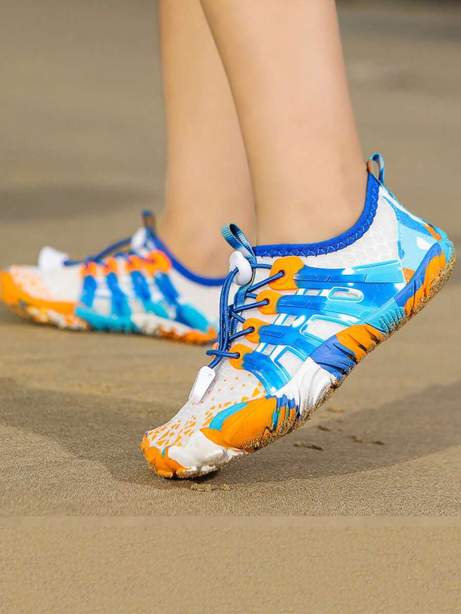 Apricot children's water shoes featuring slip-on fabric uppers, drawstring details, and rubber soles for beach play.