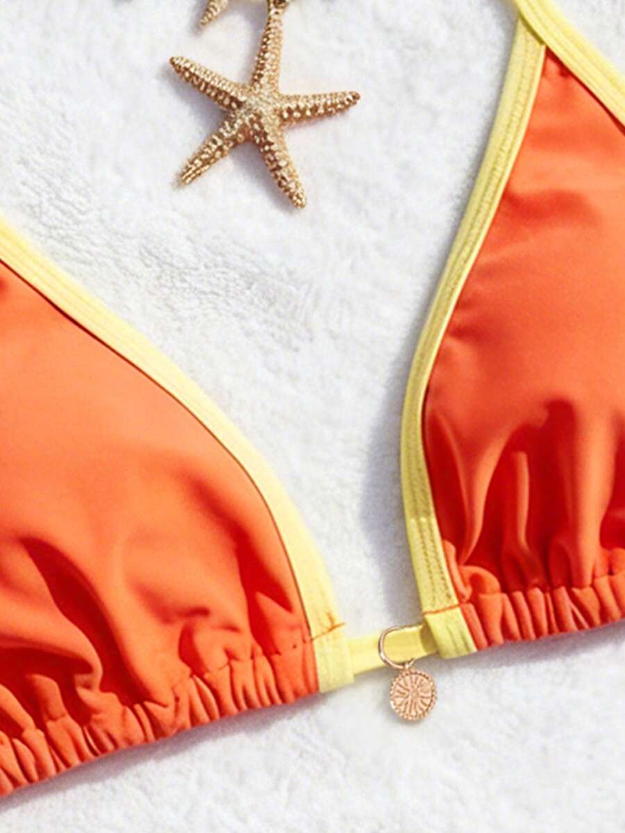 Women's high waist 2-piece triangle bikini set featuring colorblock trim, halter neckline, wireless bra with removable padding, and tie-side bottoms.