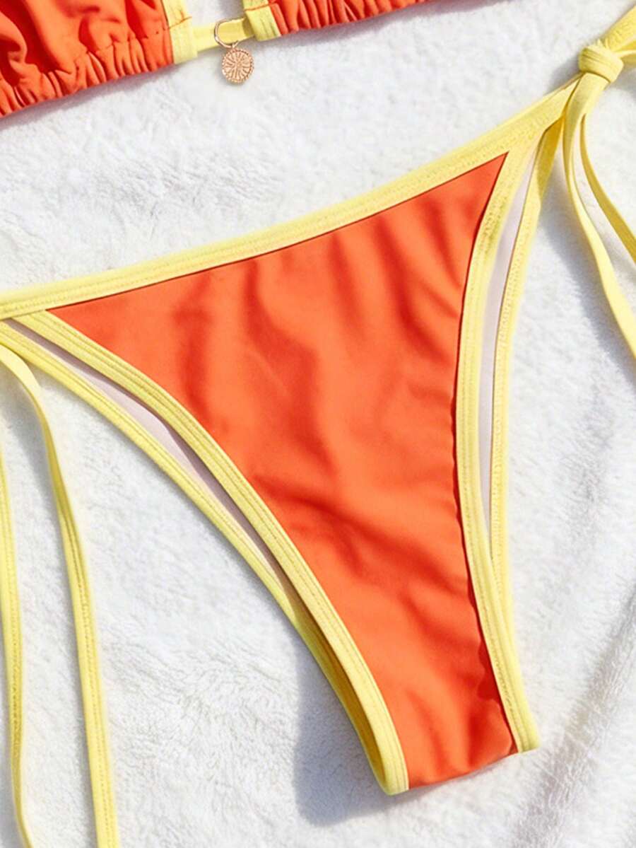 Women's high waist 2-piece triangle bikini set featuring colorblock trim, halter neckline, wireless bra with removable padding, and tie-side bottoms.