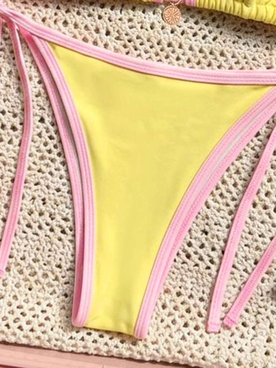 Women's high waist 2-piece triangle bikini set featuring colorblock trim, halter neckline, wireless bra with removable padding, and tie-side bottoms.