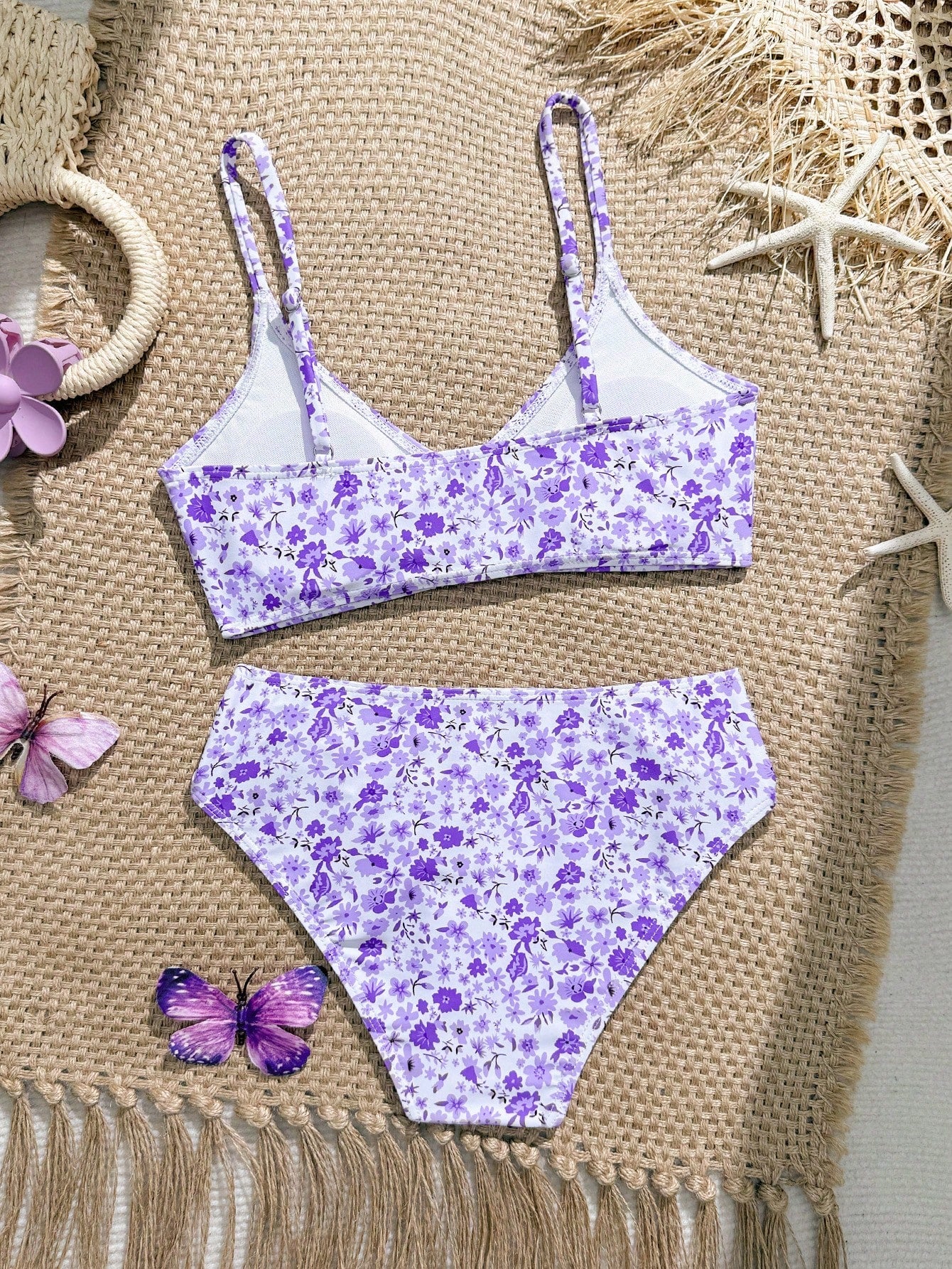 Tween girls 2-piece ditsy floral bikini set featuring a spaghetti strap top with center string detail and matching bottoms with side strings, designed for swimming, vacation, and summer wear.