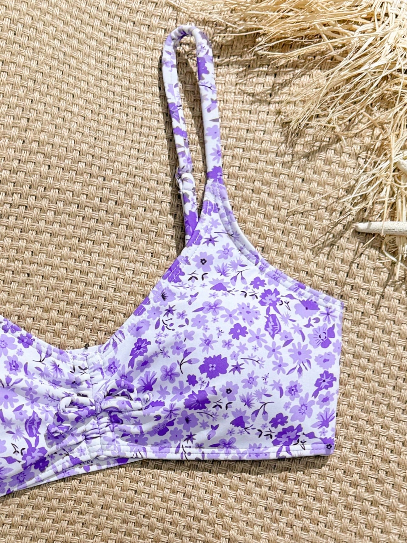Tween girls 2-piece ditsy floral bikini set featuring a spaghetti strap top with center string detail and matching bottoms with side strings, designed for swimming, vacation, and summer wear.