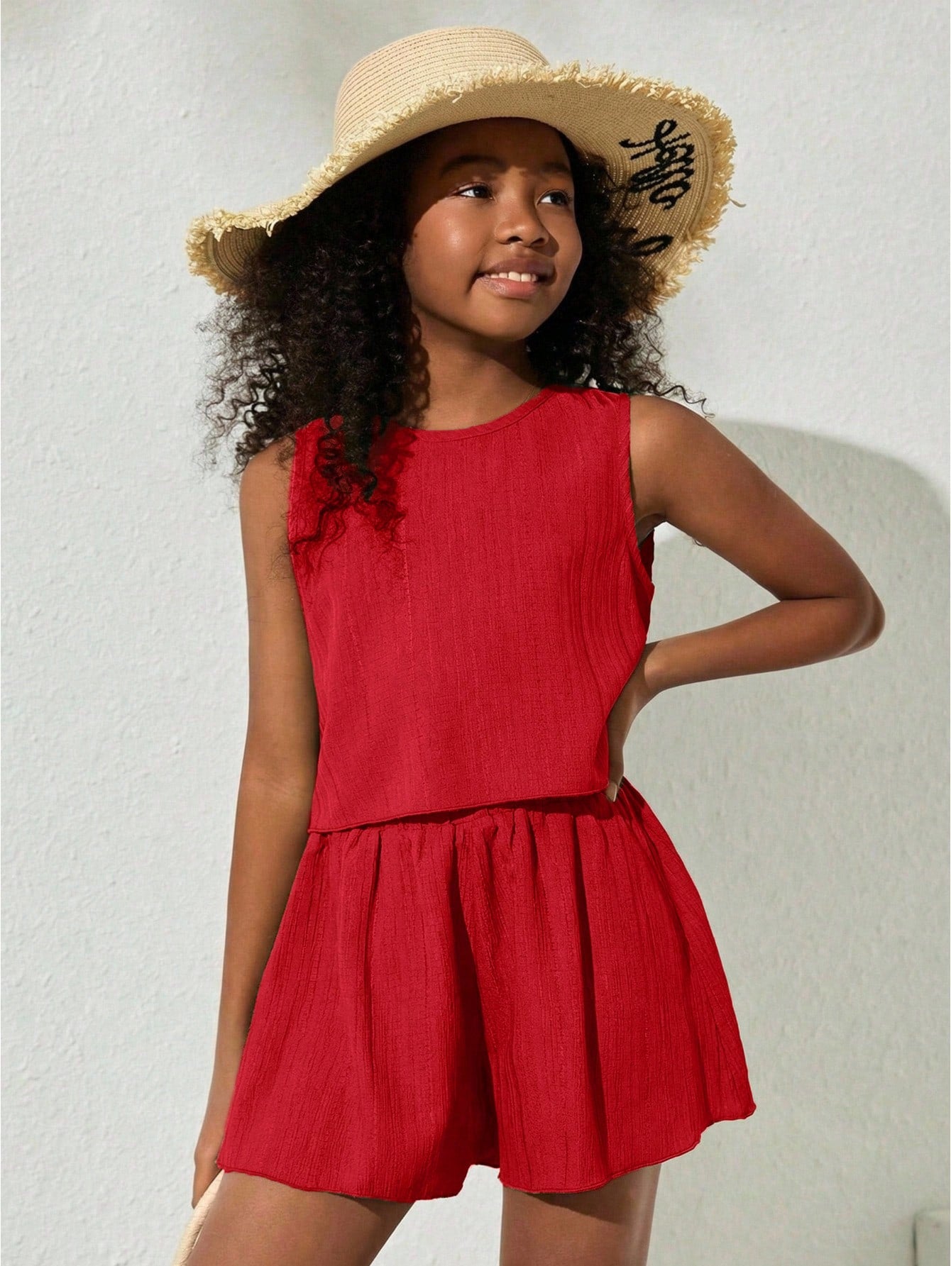 Tween girls army green casual outfit featuring a sleeveless round neck top with button details paired with matching woven loose shorts.