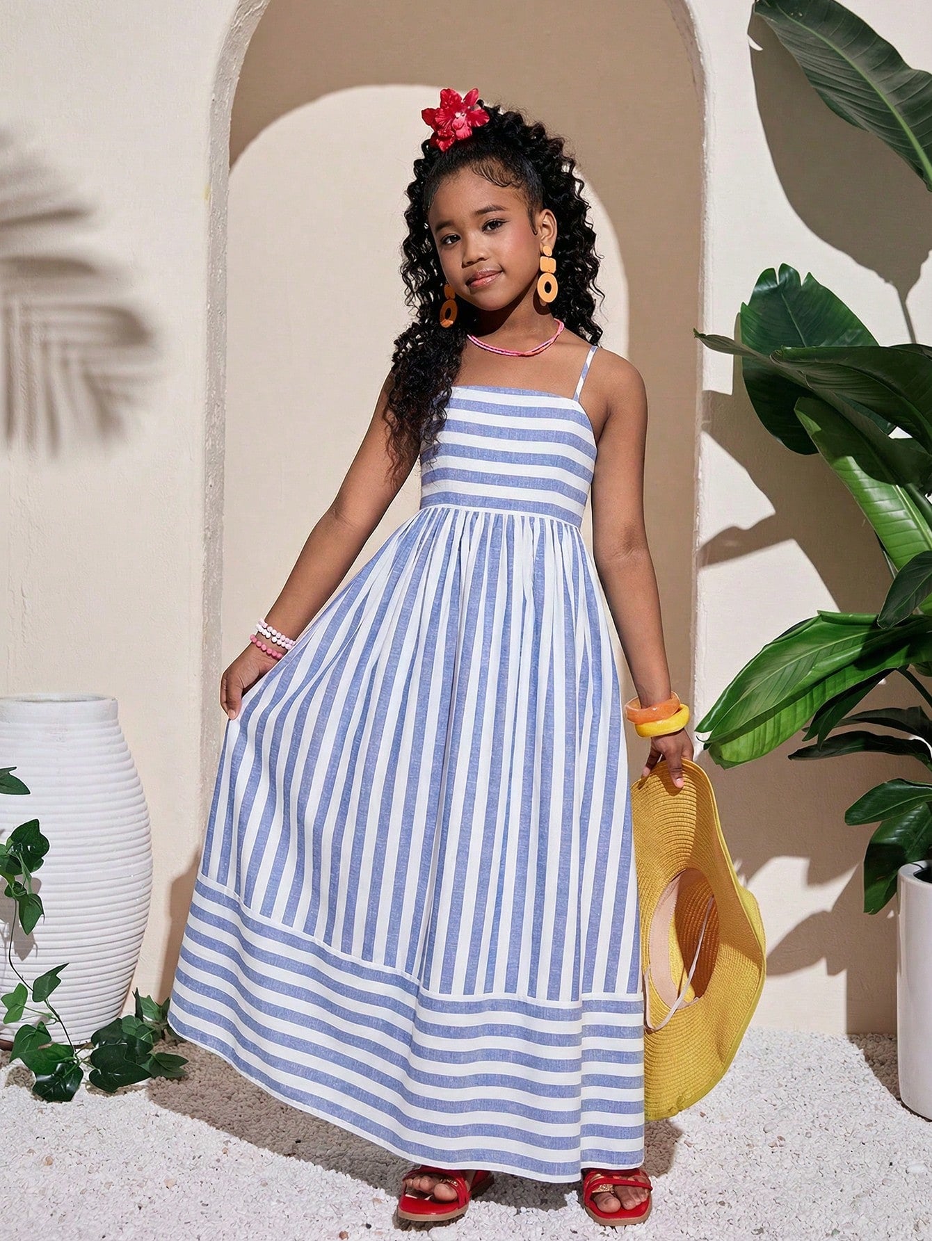 Tween girls striped spaghetti strap cami dress with high waist, shirred detail, zipper closure, sleeveless design, and flared long A-line silhouette for vacation wear.