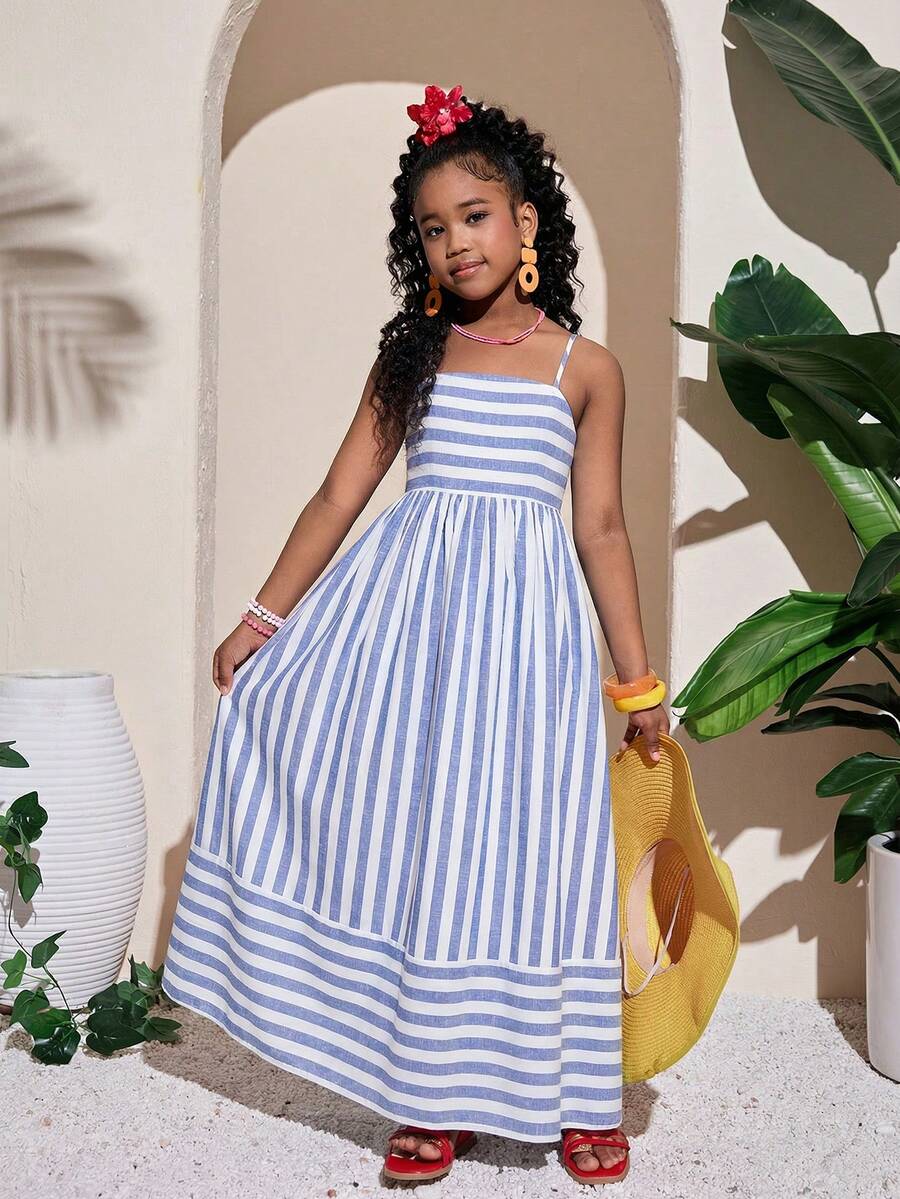 Tween girls blue striped summer camisole dress featuring spaghetti straps, high waist, flared hem, and back zipper detail.