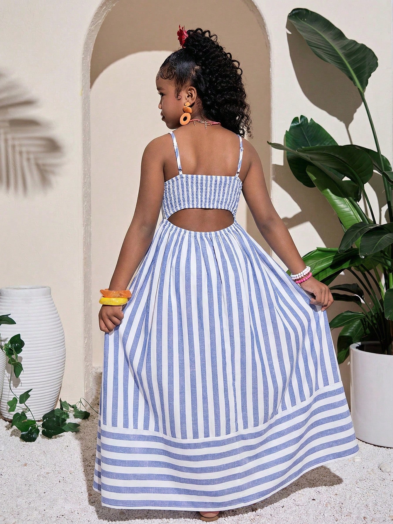 Tween girls striped spaghetti strap cami dress with high waist, shirred detail, zipper closure, sleeveless design, and flared long A-line silhouette for vacation wear.