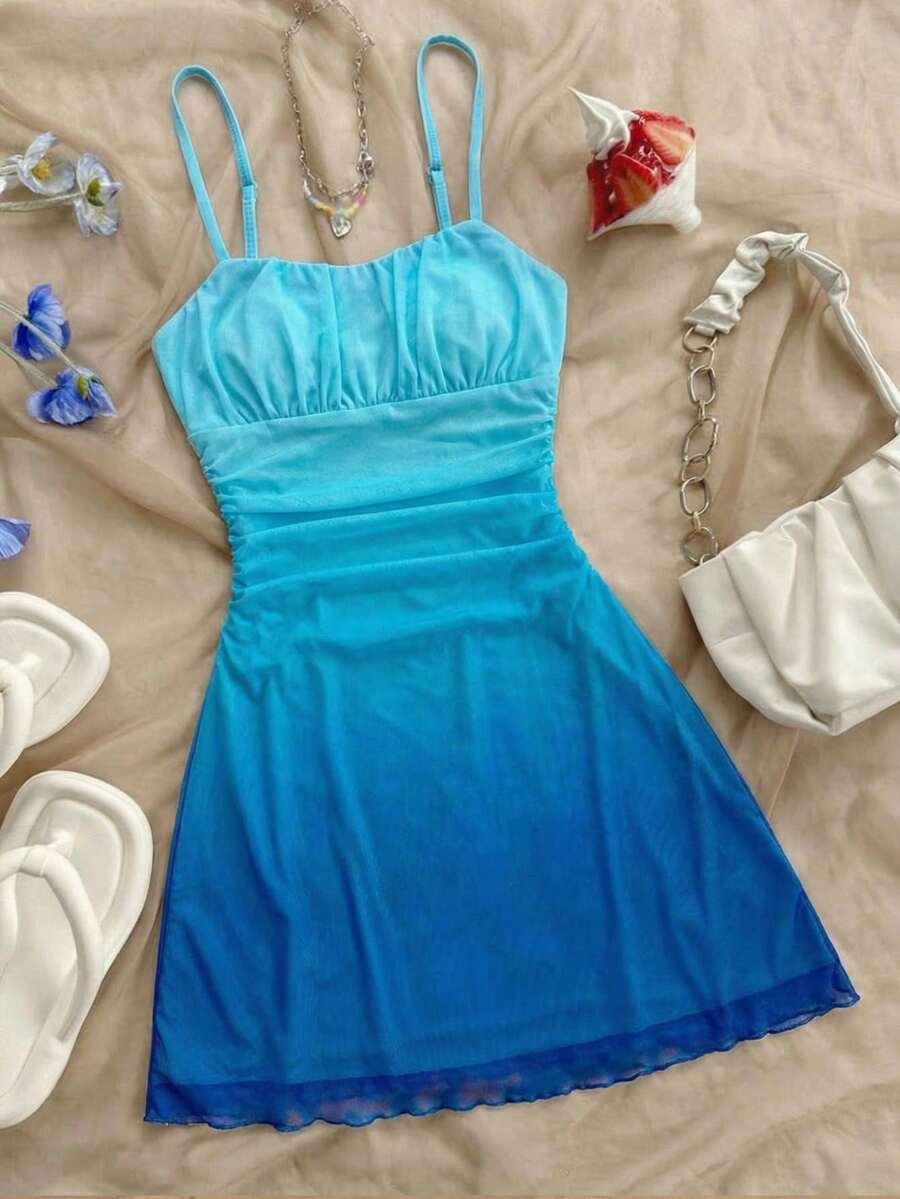Tween girls blue sleeveless cami dress with spaghetti straps, ruched bust, short slim fit, and vacation-ready style