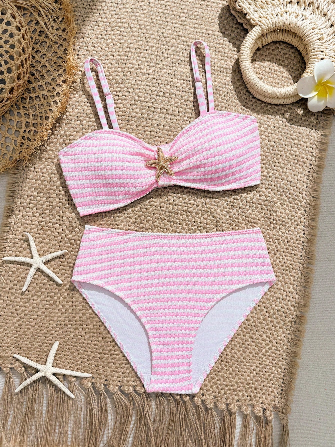 Tween girls pink and white striped two-piece bikini set with spaghetti strap bandeau top, starfish decor, and high waist swim bottoms for beach and vacation wear