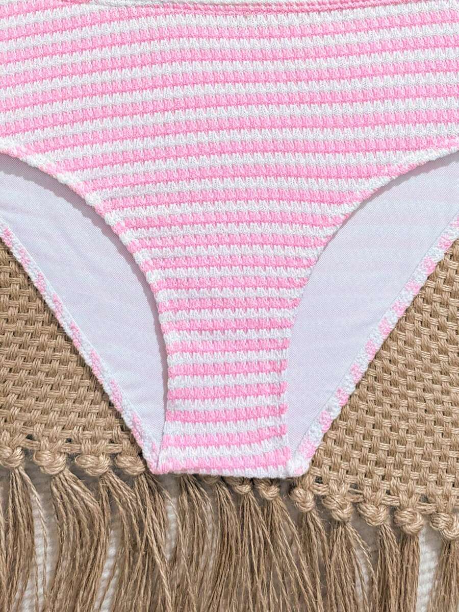 Tween girls pink and white striped two-piece bikini set with spaghetti strap bandeau top, starfish decor, and high waist swim bottoms for beach and vacation wear