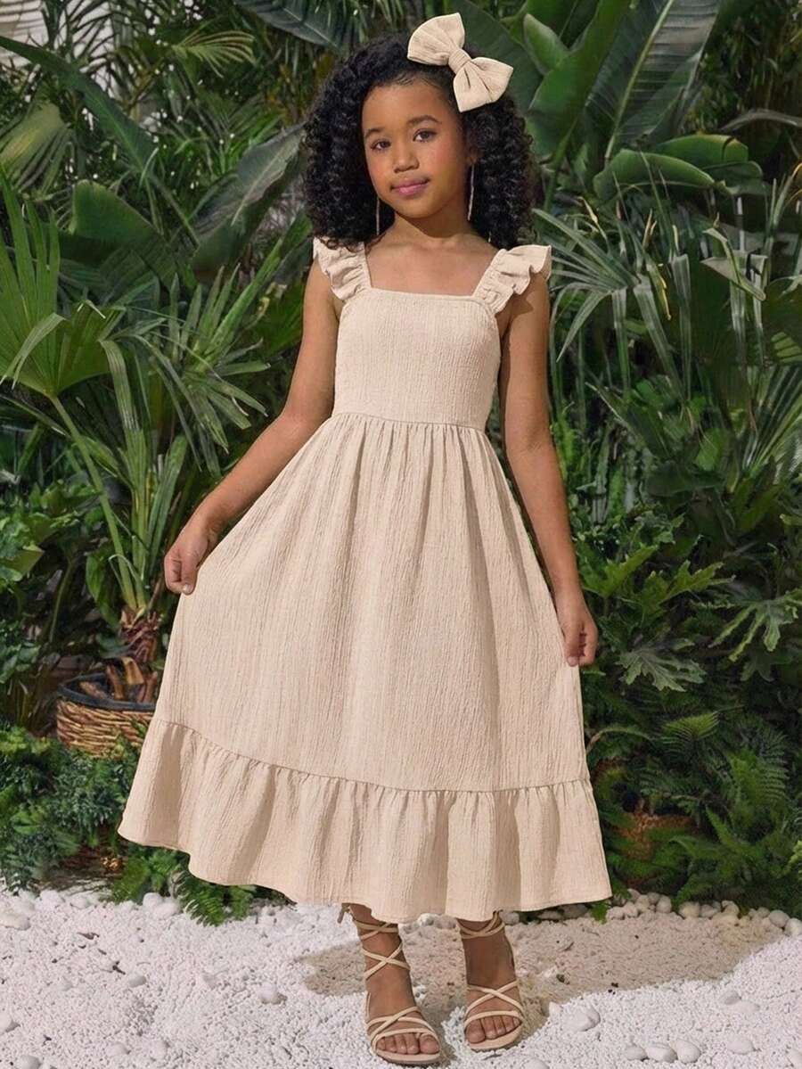 Blue floral print long vacation dress for tween girls featuring an A-line high waist silhouette with ruffle details and spaghetti straps.