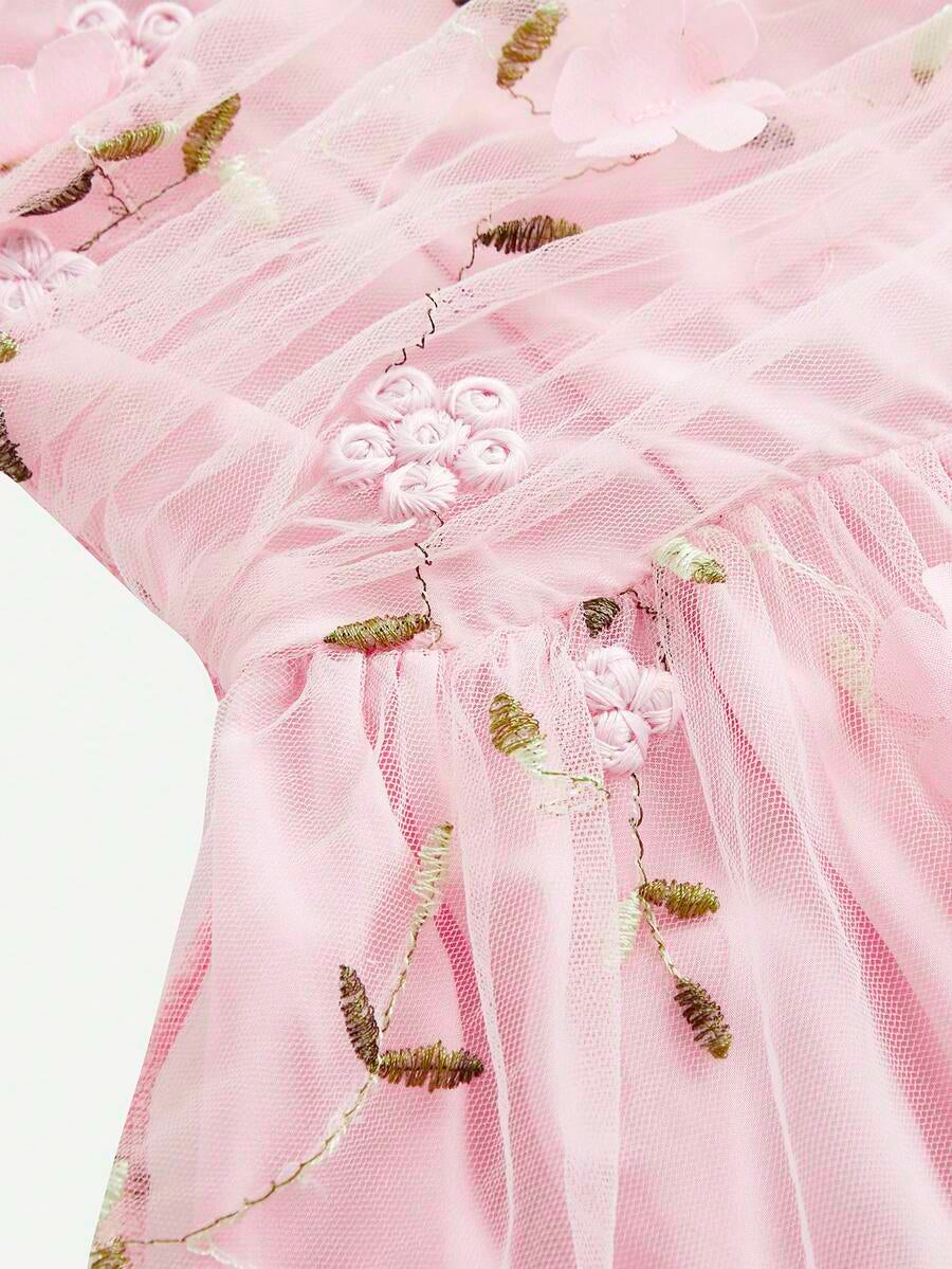 Pink floral print sleeveless cami dress for tween girls featuring spaghetti straps, ruched bust, high waist, and flared short hem.