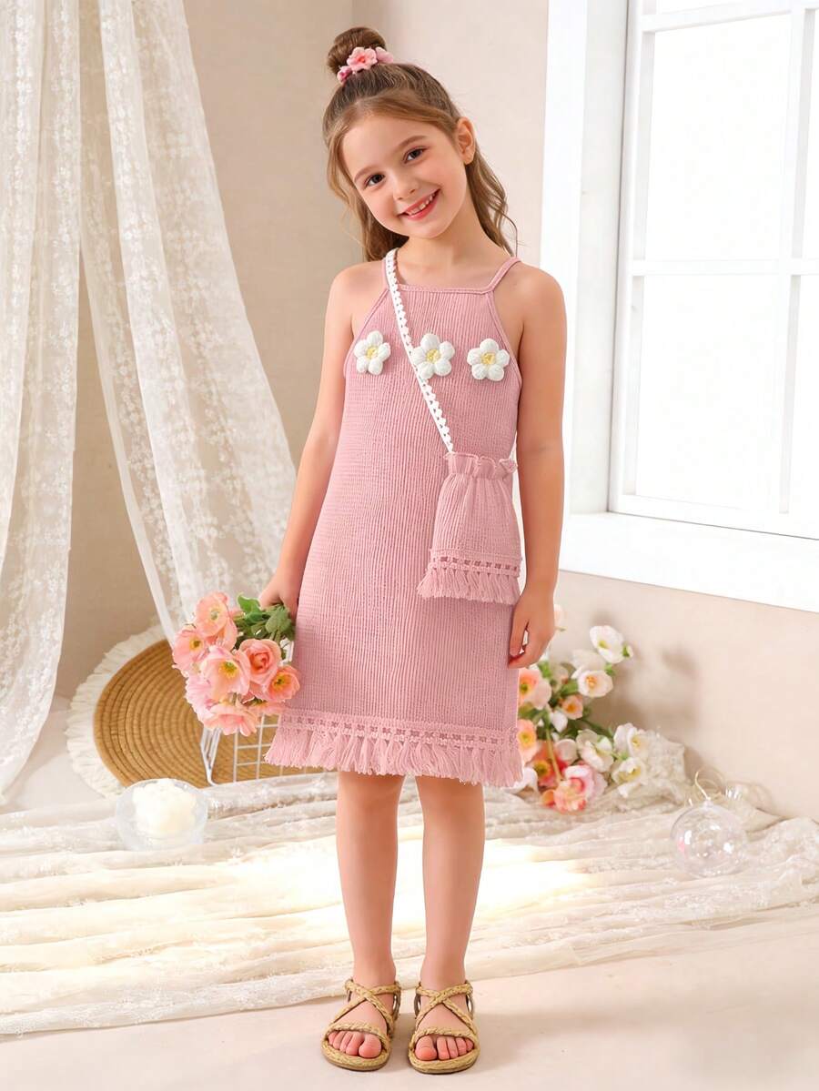 Girls' sleeveless summer midi dress with halter neckline, geometric pattern, applique and fringe details, shown with crossbody bag accessory with tassel decor