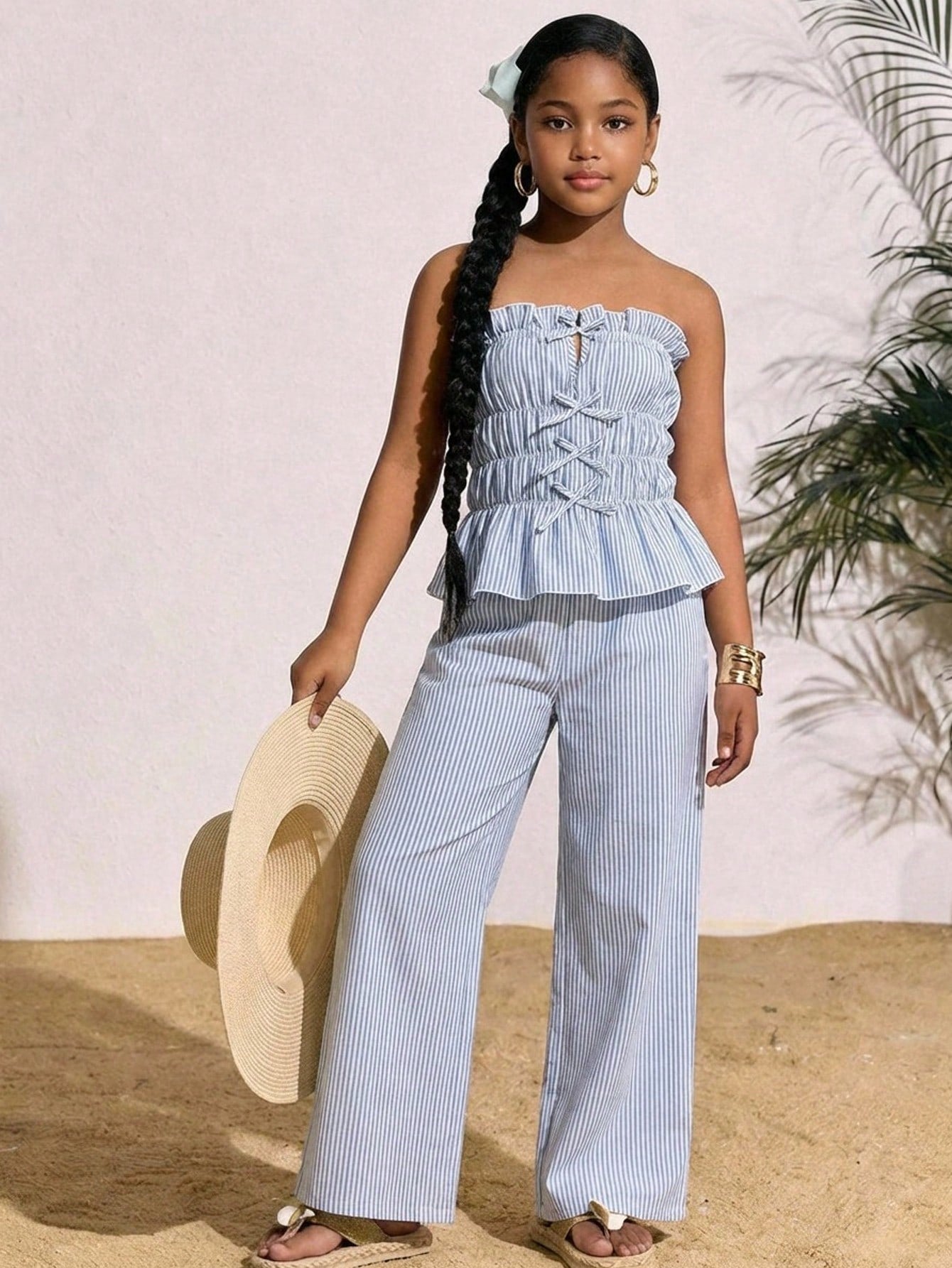 Tween girls casual tube top and elastic waist pants set with shirred ruffle details, strapless short top, and long pants in multicolor styling.