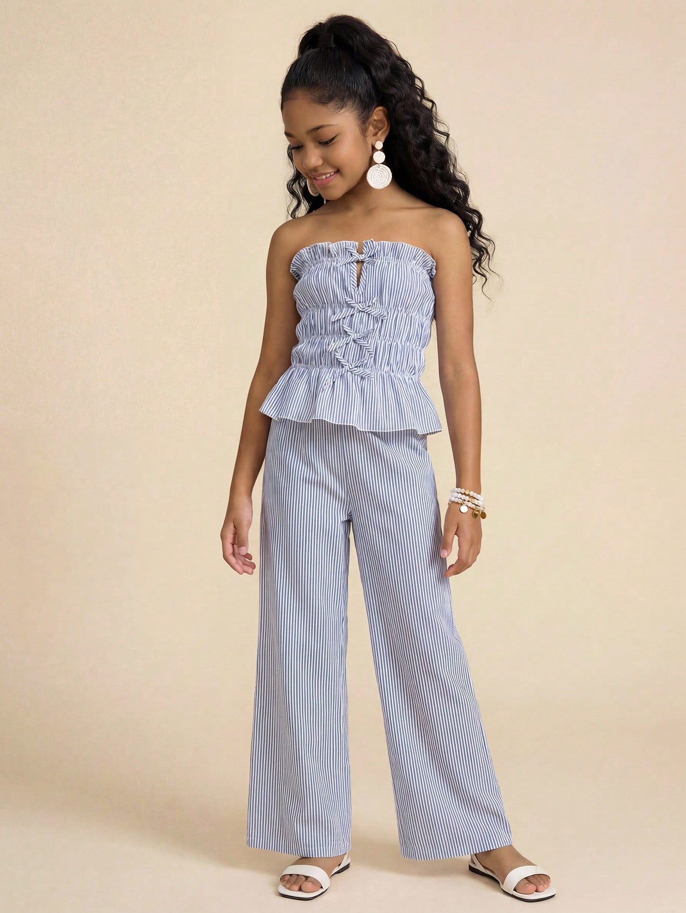Tween girls casual tube top and elastic waist pants set with shirred ruffle details, strapless short top, and long pants in multicolor styling.