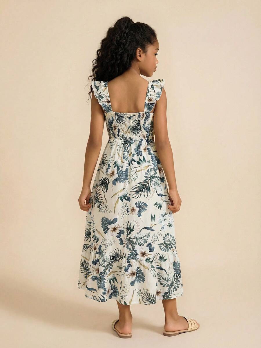 Blue floral print long vacation dress for tween girls featuring an A-line high waist silhouette with ruffle details and spaghetti straps.