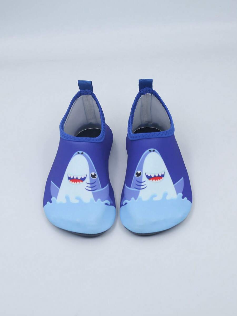 Pair of lightweight slip-on kids water shoes with breathable upper and non-slip outsole for summer beach and pool wear.