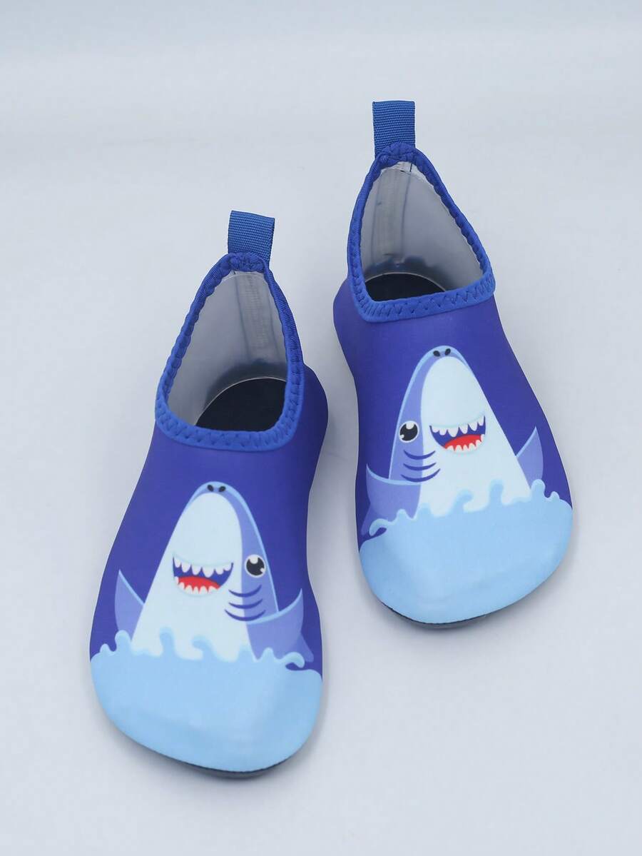 Pair of lightweight slip-on kids water shoes with breathable upper and non-slip outsole for summer beach and pool wear.
