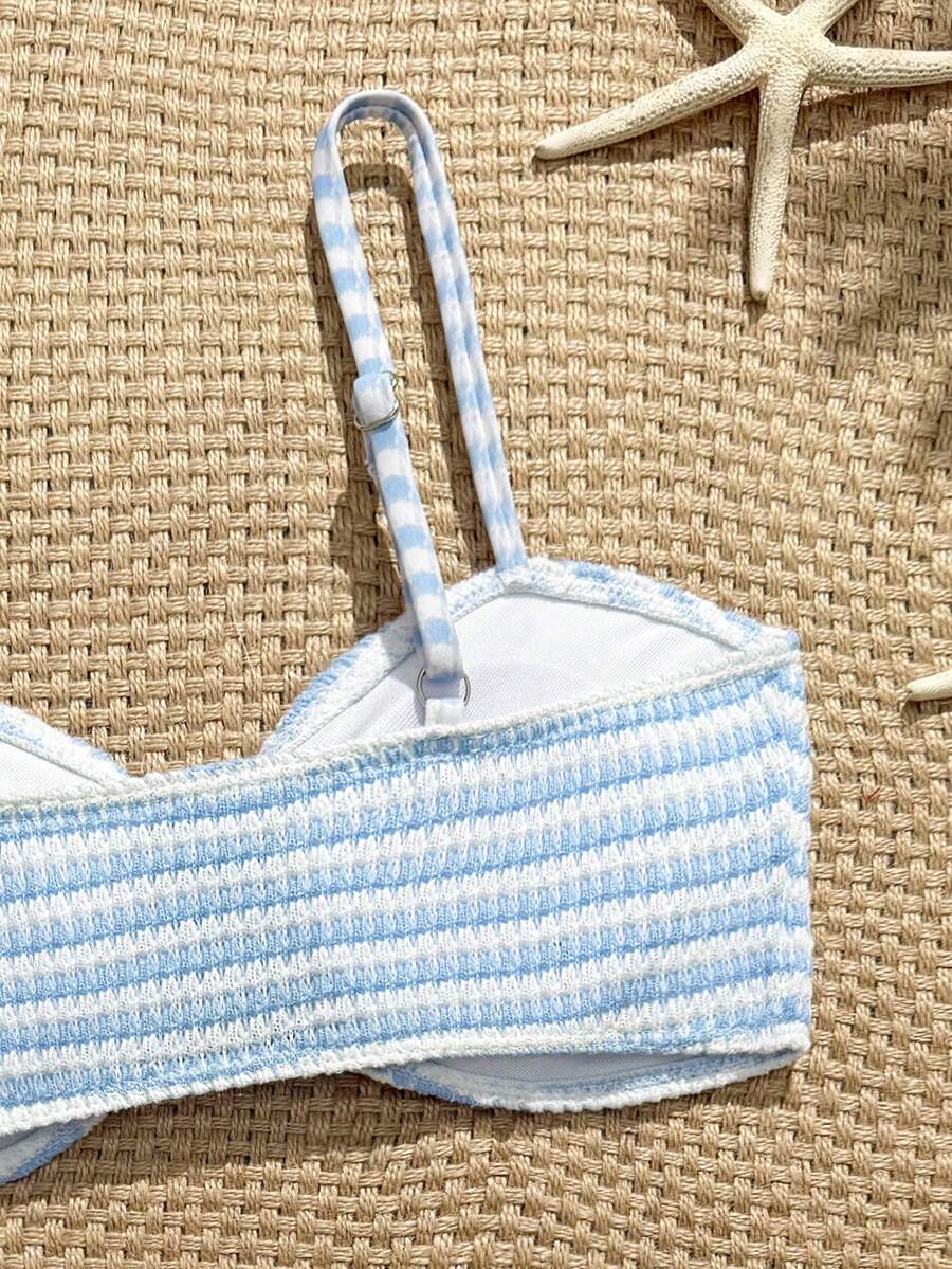 Tween girls pink and white striped two-piece bikini set with spaghetti strap bandeau top, starfish decor, and high waist swim bottoms for beach and vacation wear