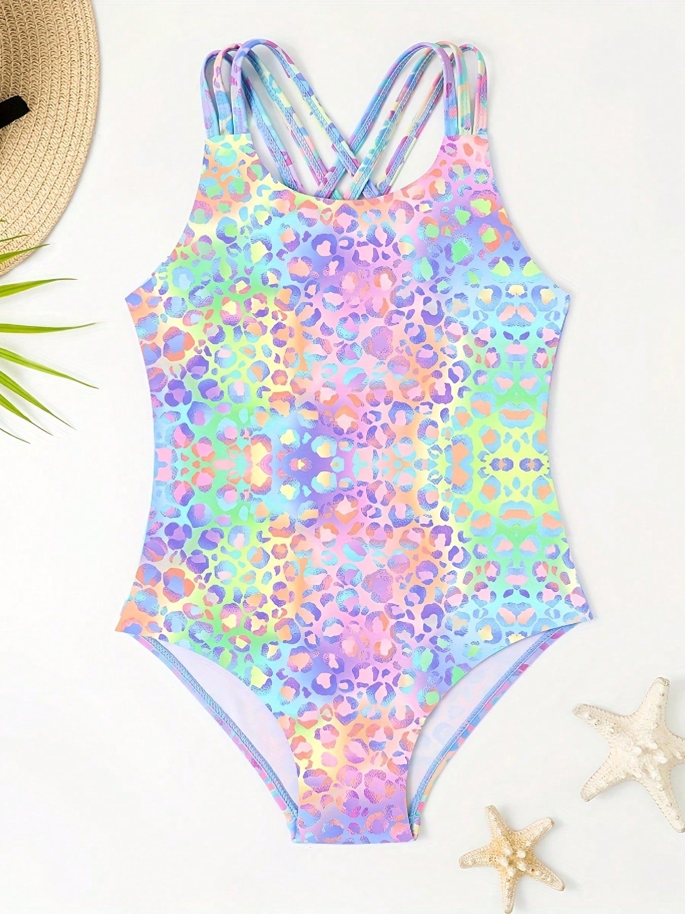 Girls' multicolor ombre leopard print one-piece swimsuit with scoop neck, ruffle detail, and criss-cross back design for summer pool wear.